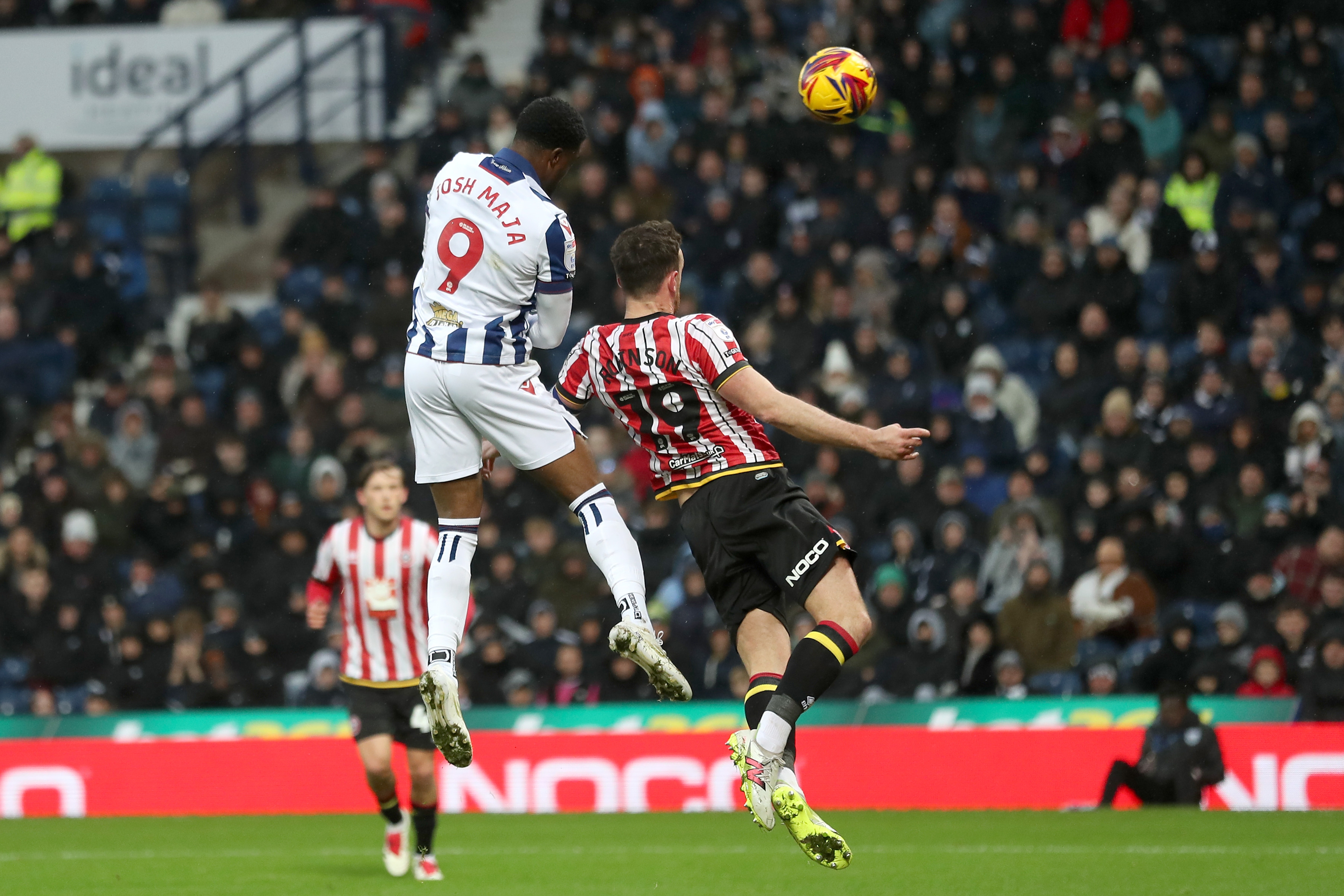 Josh Maja jumps to try and win a header against Sheffield United 