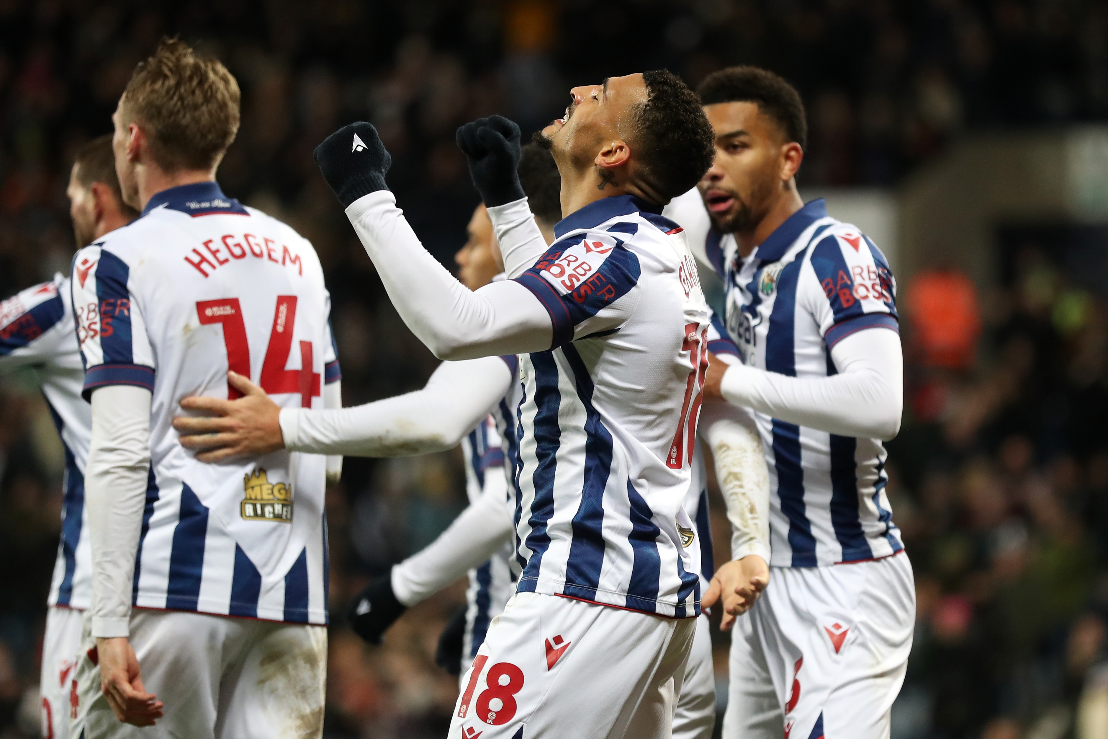 Karlan Grant celebrates scoring against Coventry City with team-mates