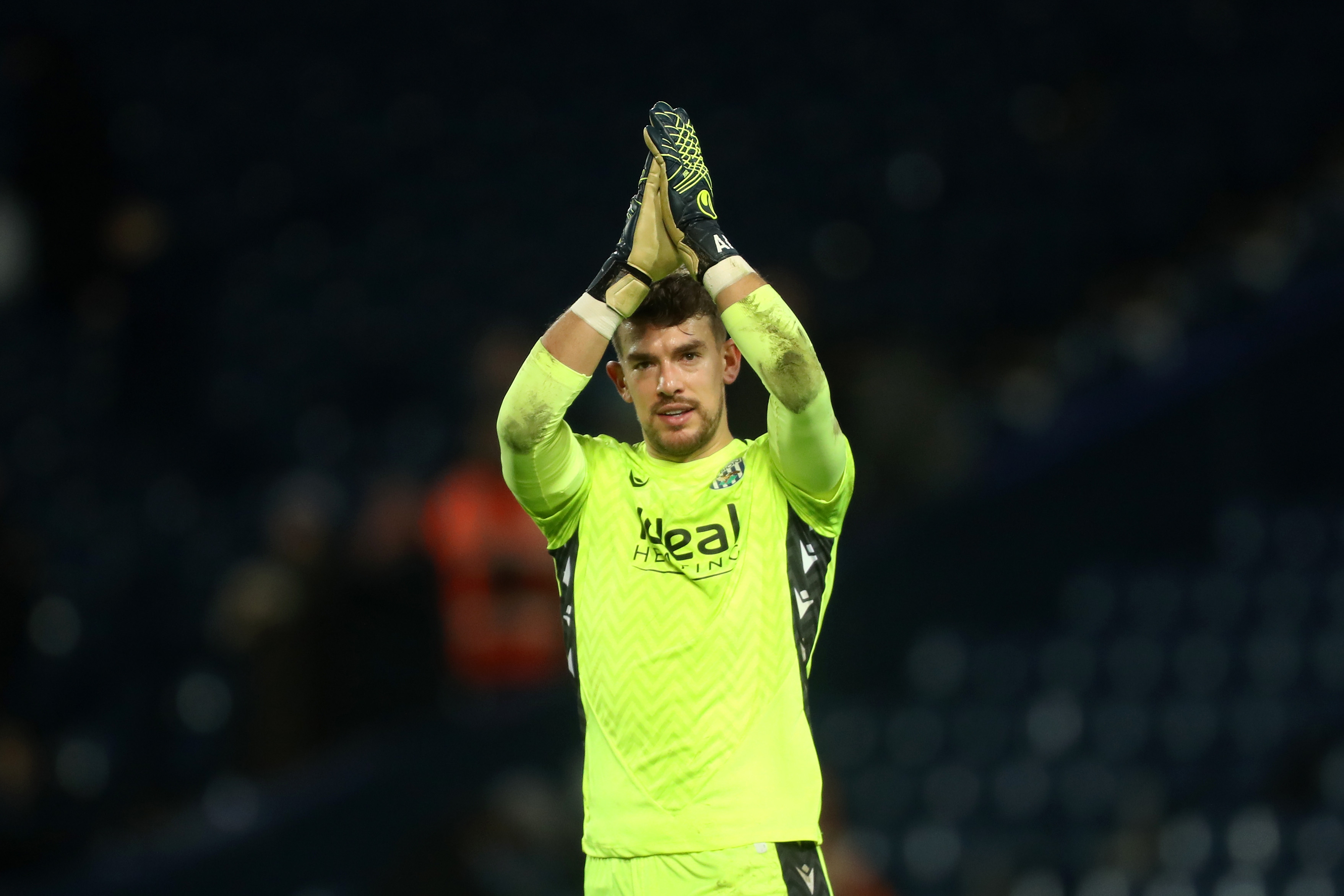 Alex Palmer applauds supporters after Albion's win against Coventry City 