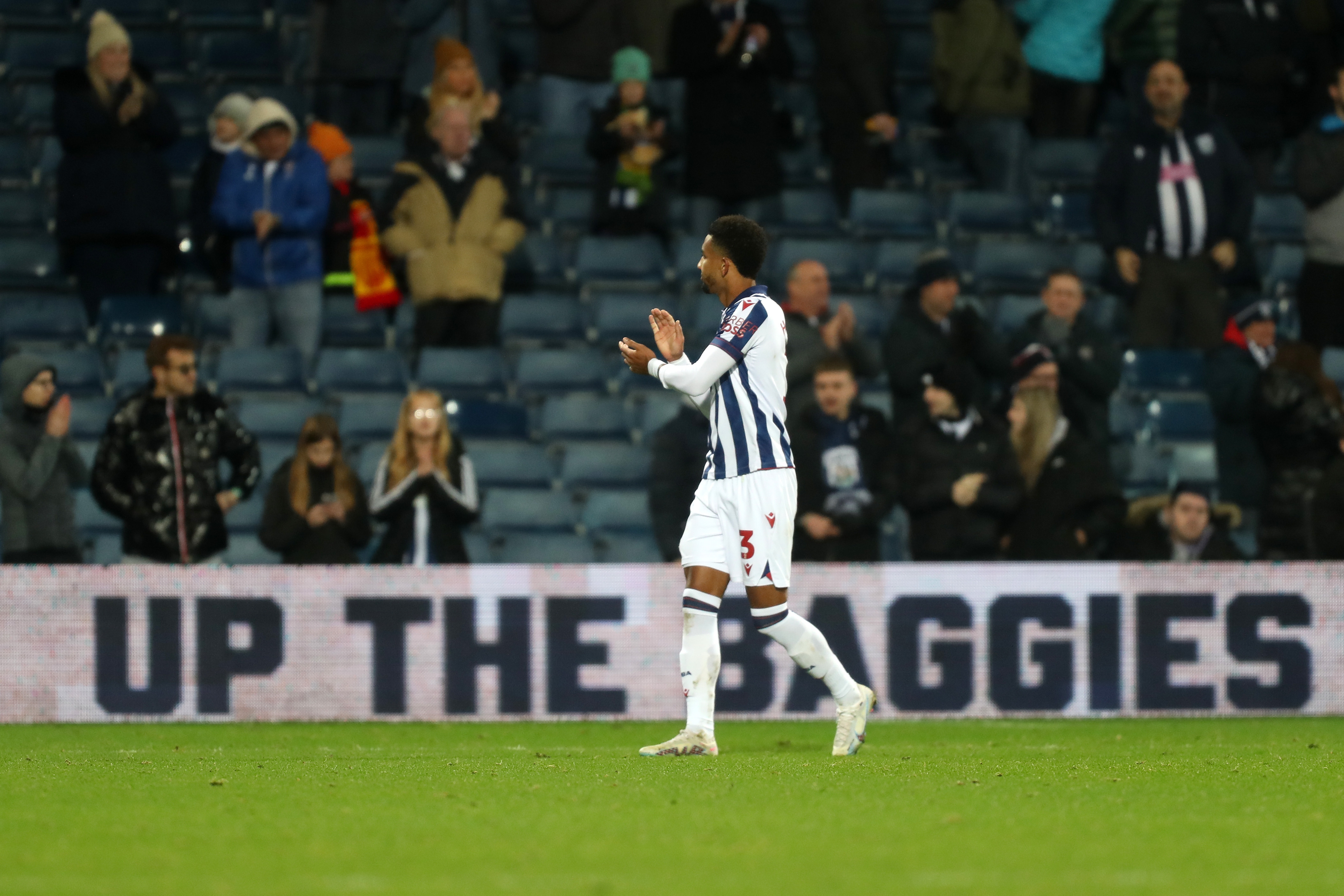 Mason Holgate applauds supporters after Albion's win against Coventry City 