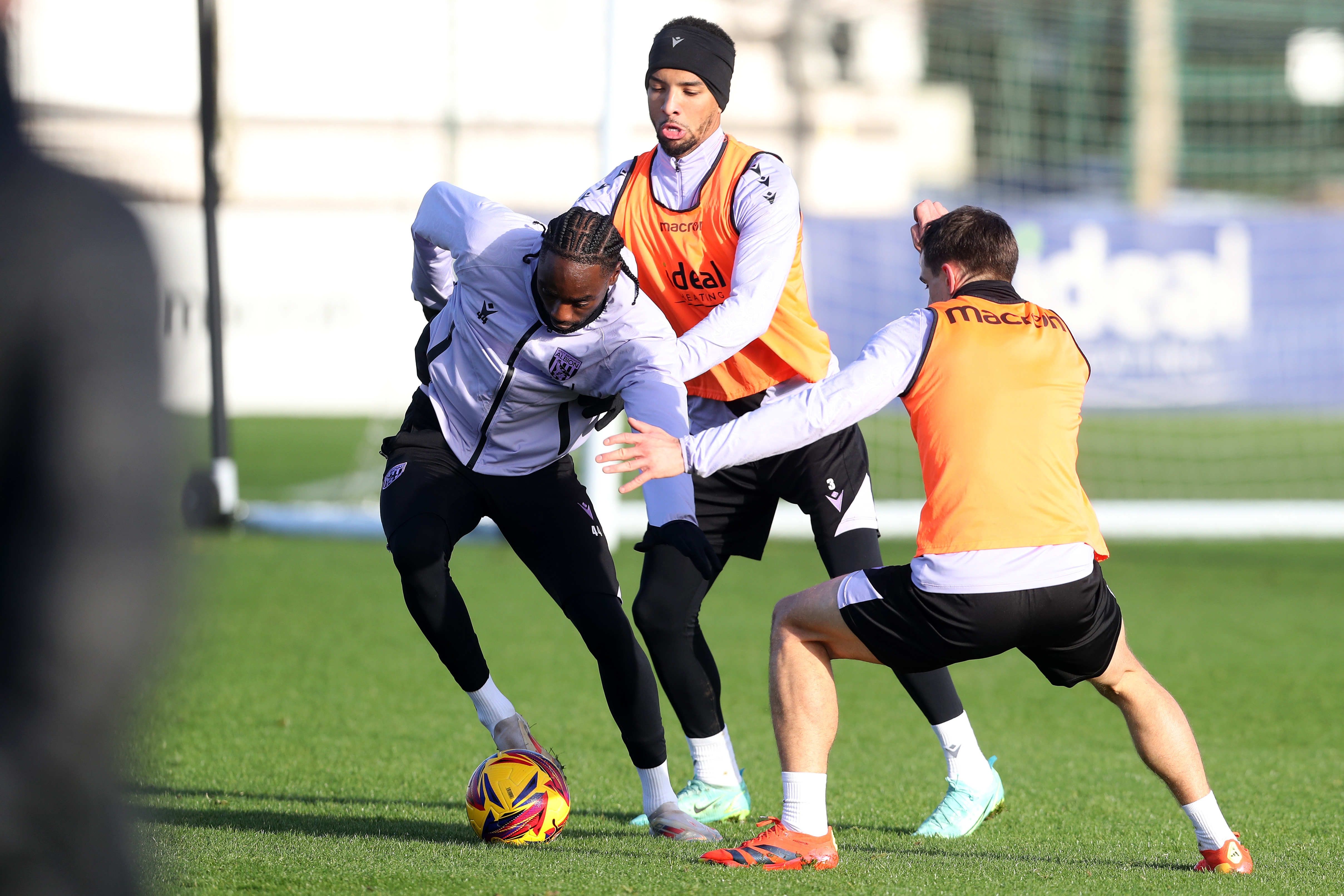 Devante Cole on the ball during training closely watched by Mason Holgate and Jayson Molumby 