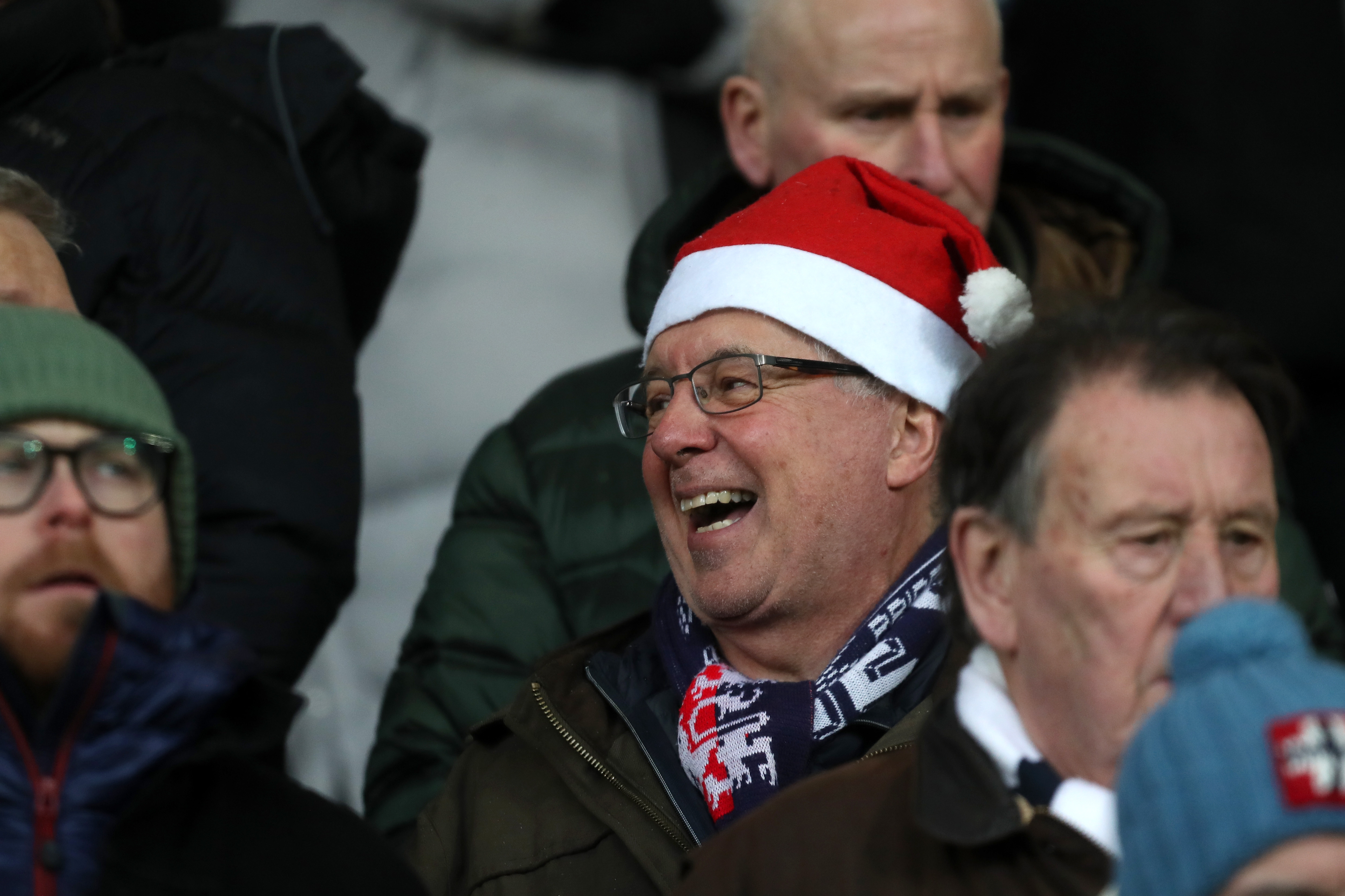 Albion fan with a Santa hat on in the crowd at The Hawthorns against Bristol City