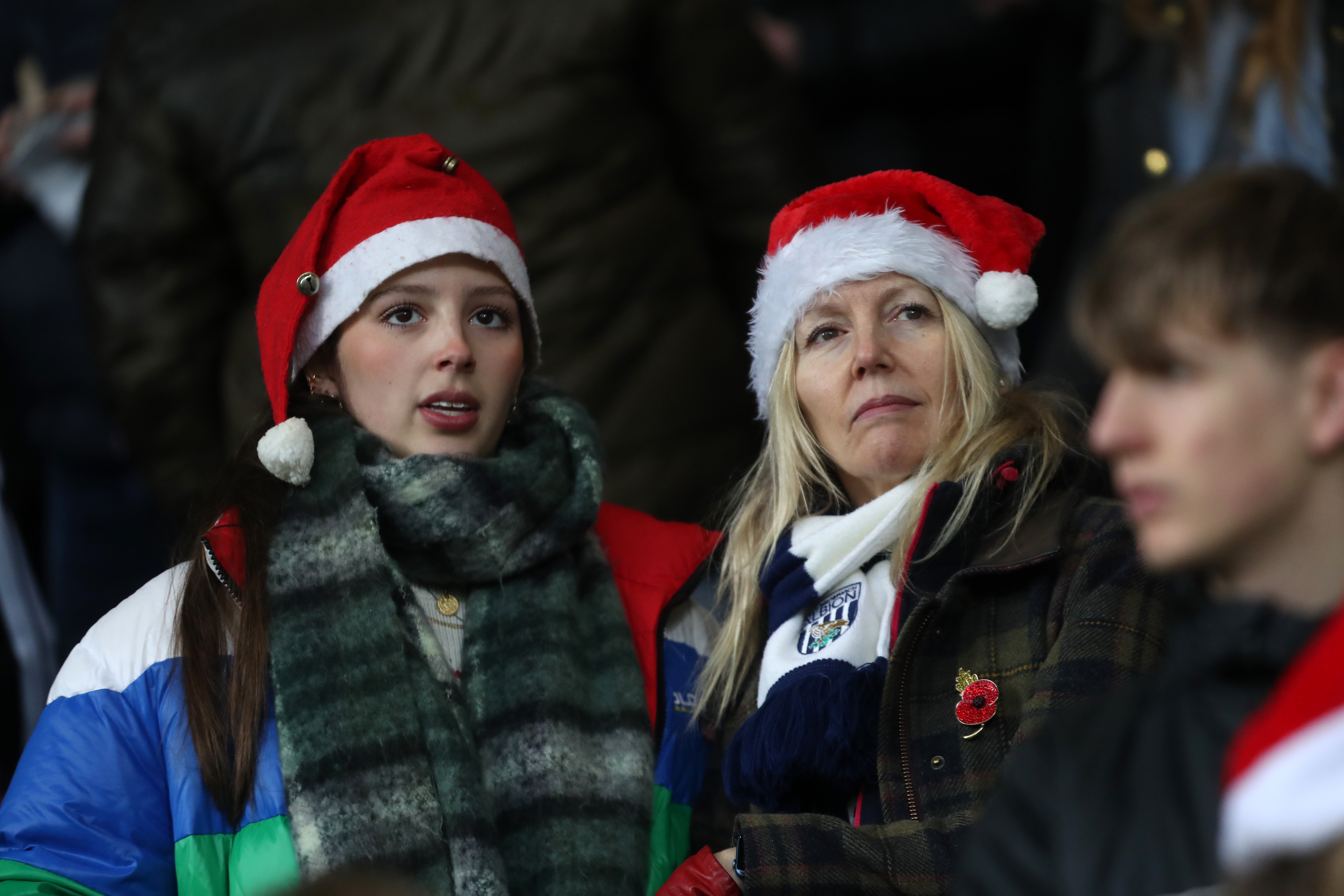 Albion fan with a Santa hat on in the crowd at The Hawthorns against Bristol City