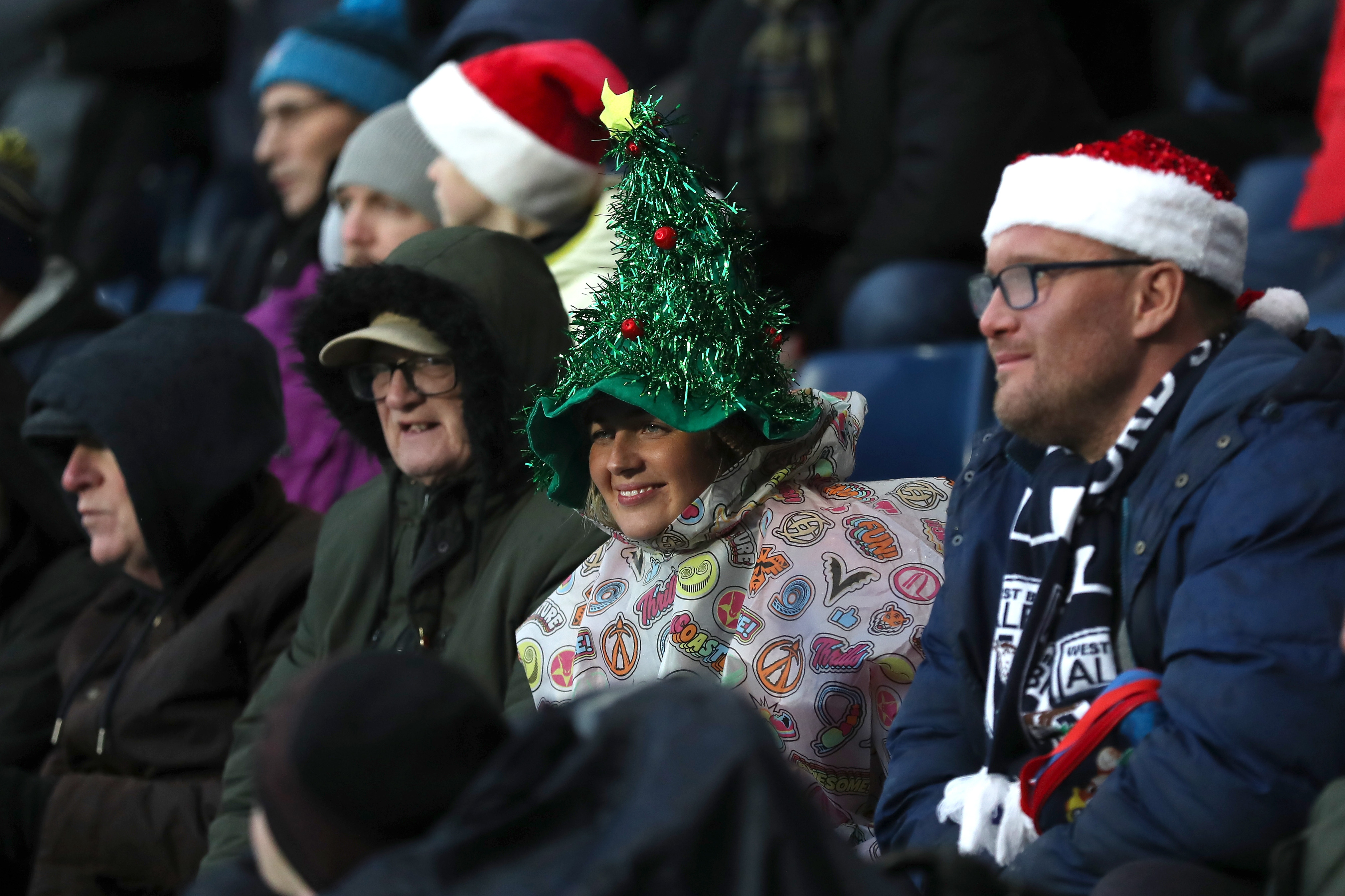 Albion fan with a Santa hat on in the crowd at The Hawthorns against Bristol City