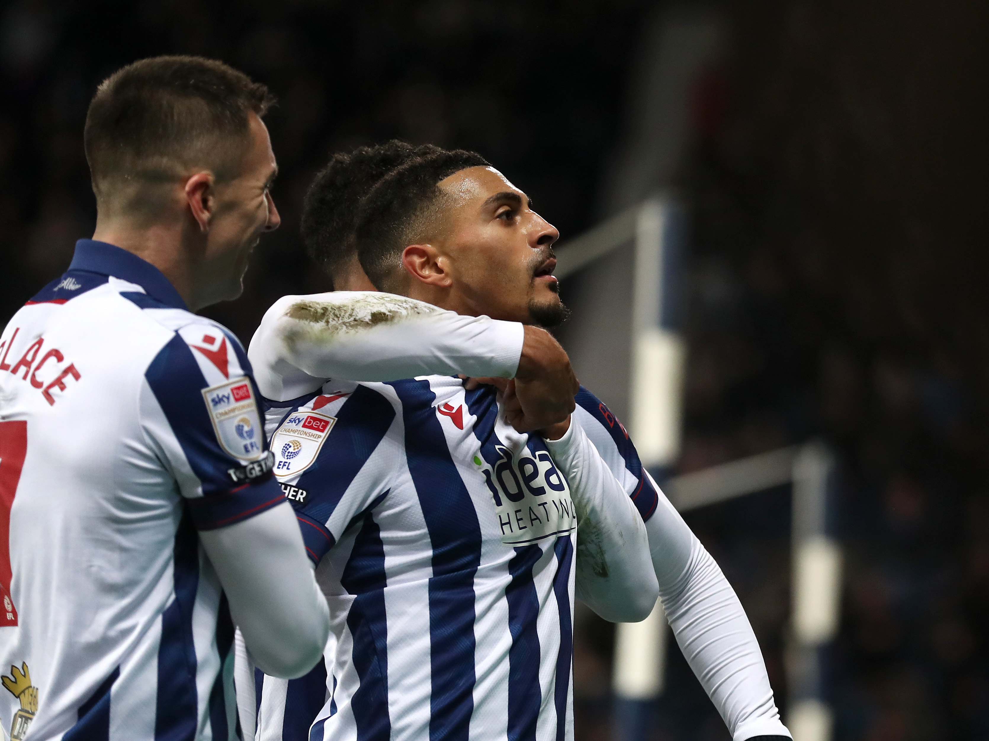 Karlan Grant celebrates scoring against Coventry City with team-mates 