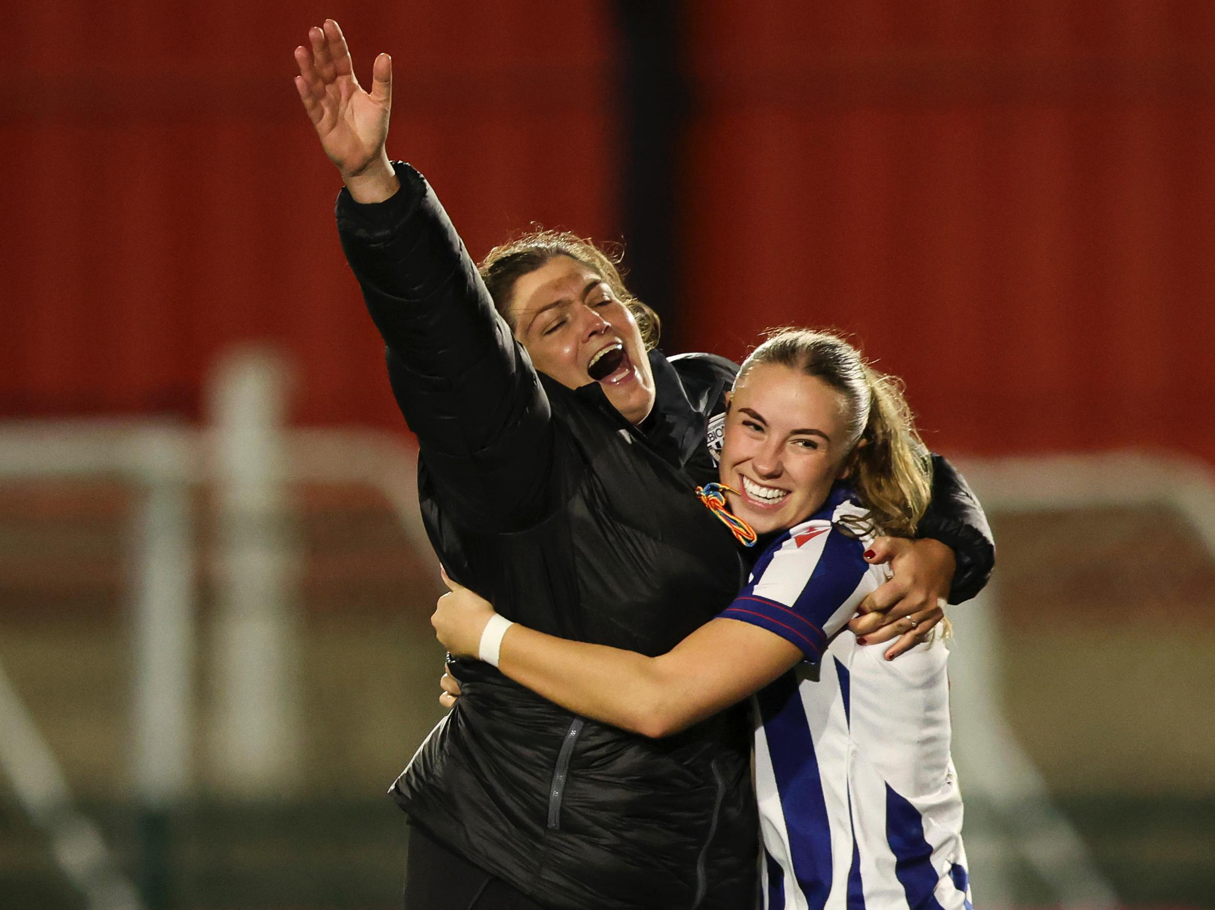 Siobhan Hodgetts-Still celebrating with Seren Watkins after beating Wolves on pens 