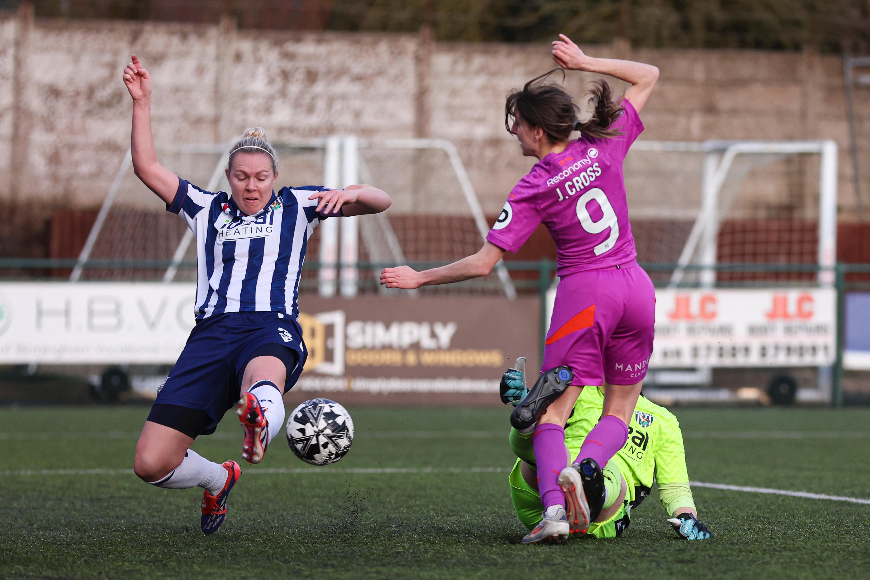 Hannah George saves a certain goal against Wolves.