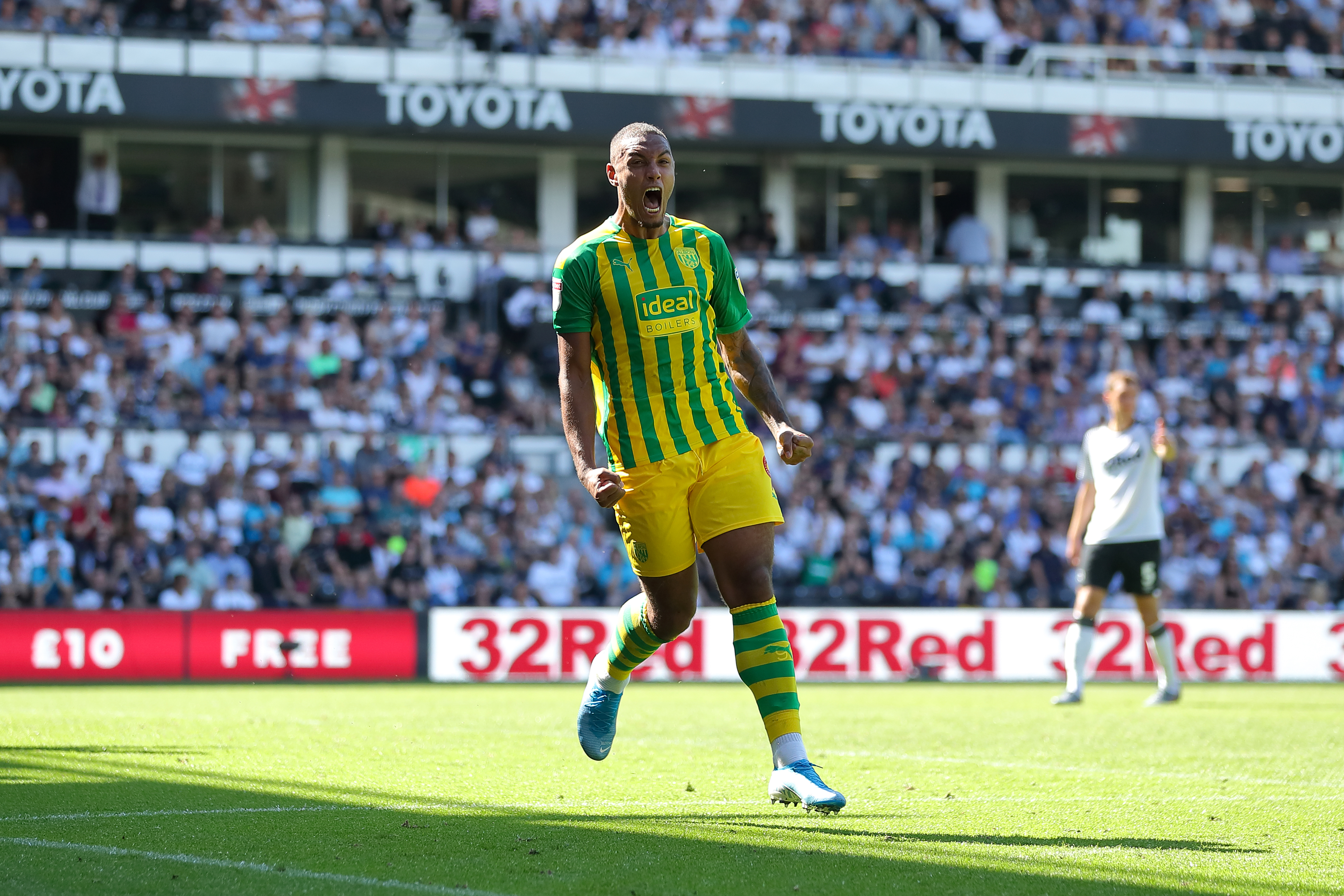 Ken Zohore celebrates scoring a penalty for Albion at Derby in August 2019 