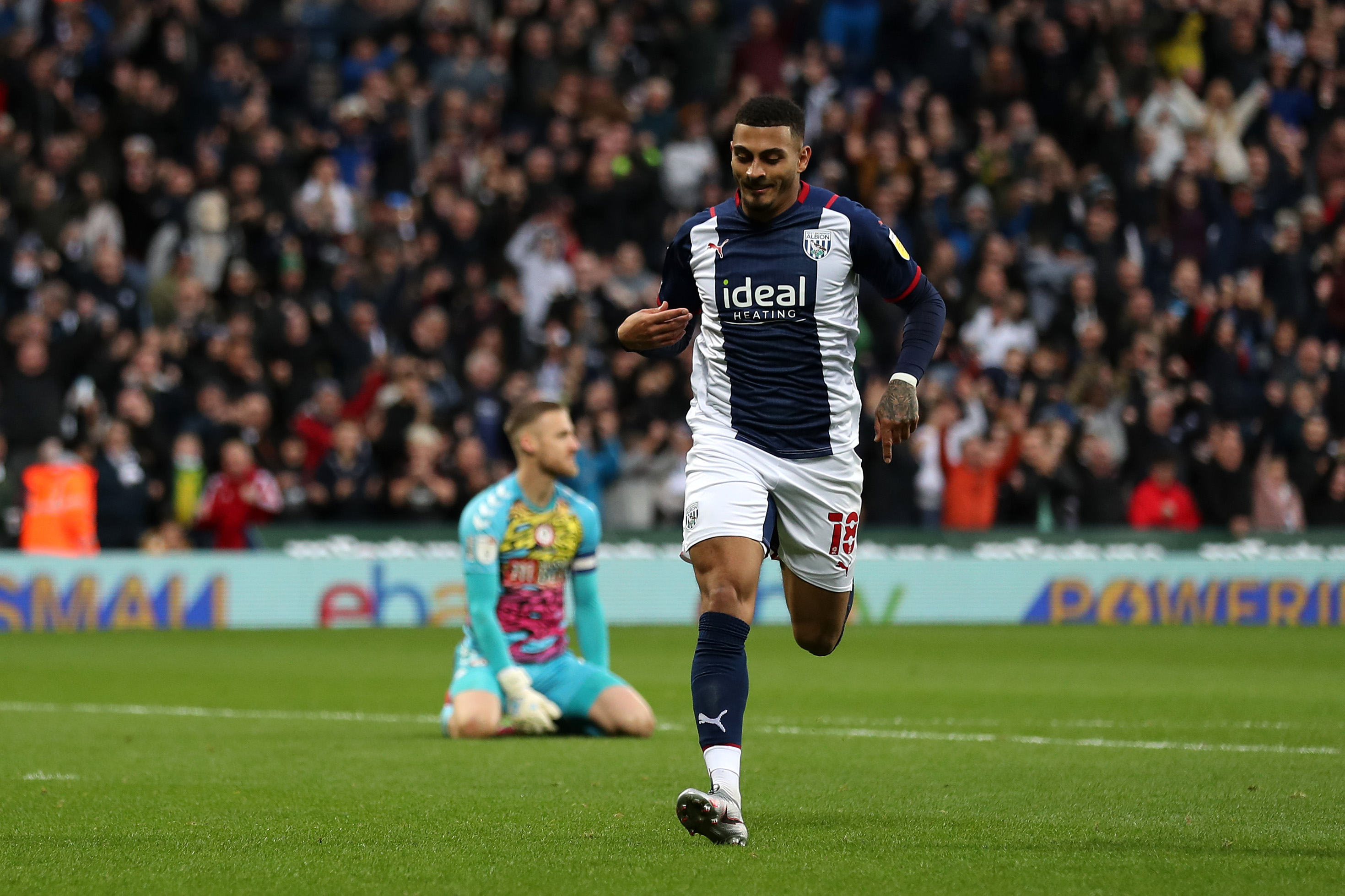 Karlan Grant celebrates scoring against Bristol City at The Hawthorns in October 2021