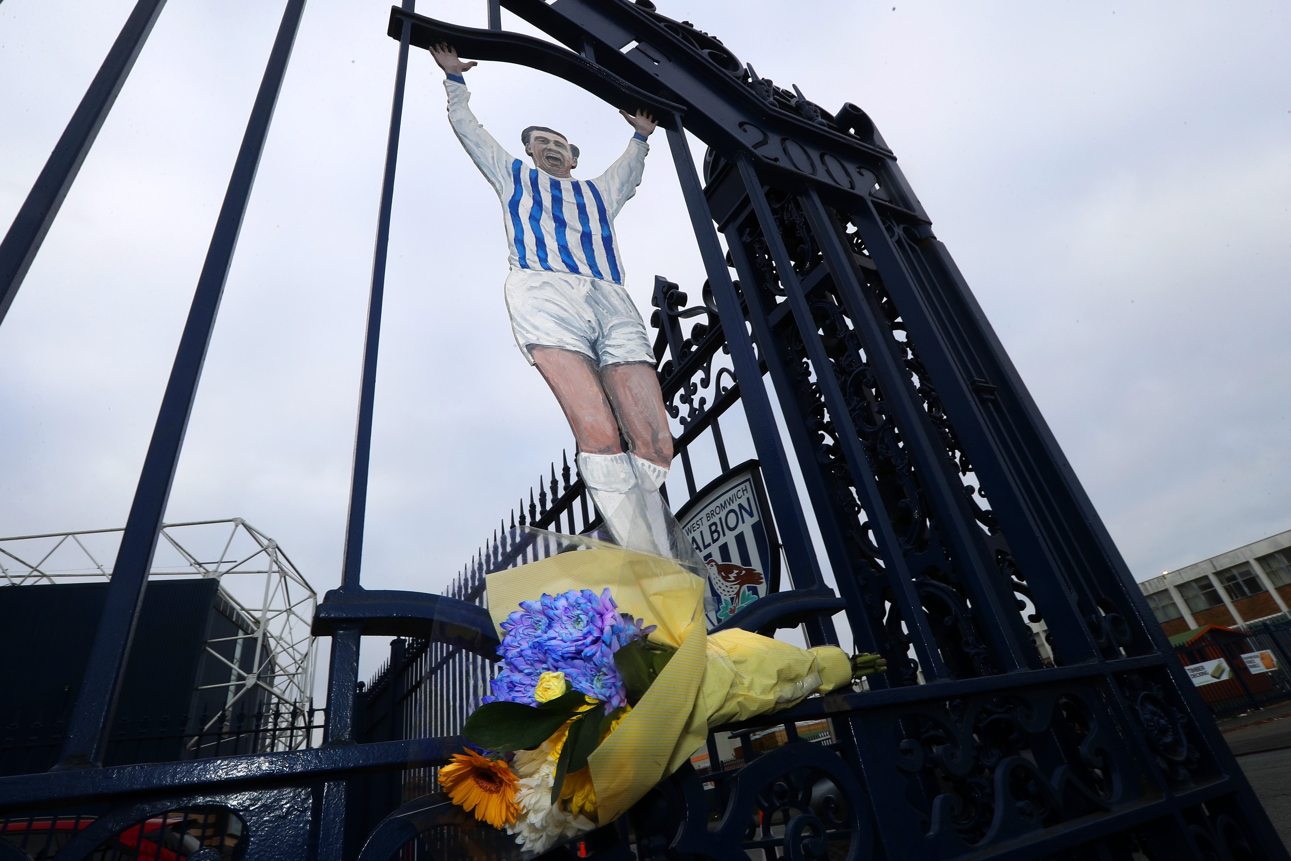 The Astle Gates at The Hawthorns with a bouquet of flowers 