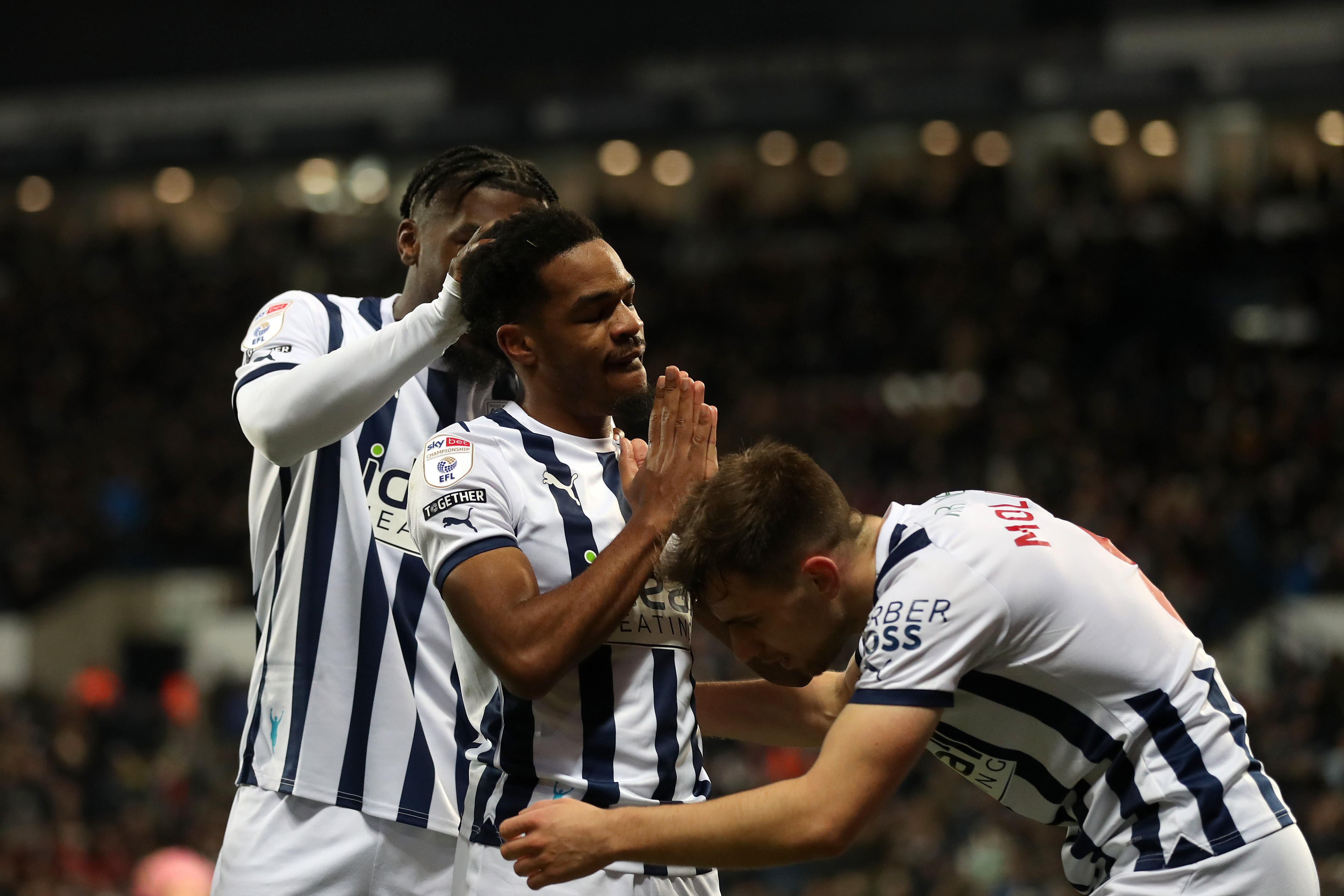 Grady Diangana celebrates scoring against Leeds at The Hawthorns in the home kit in December 2023