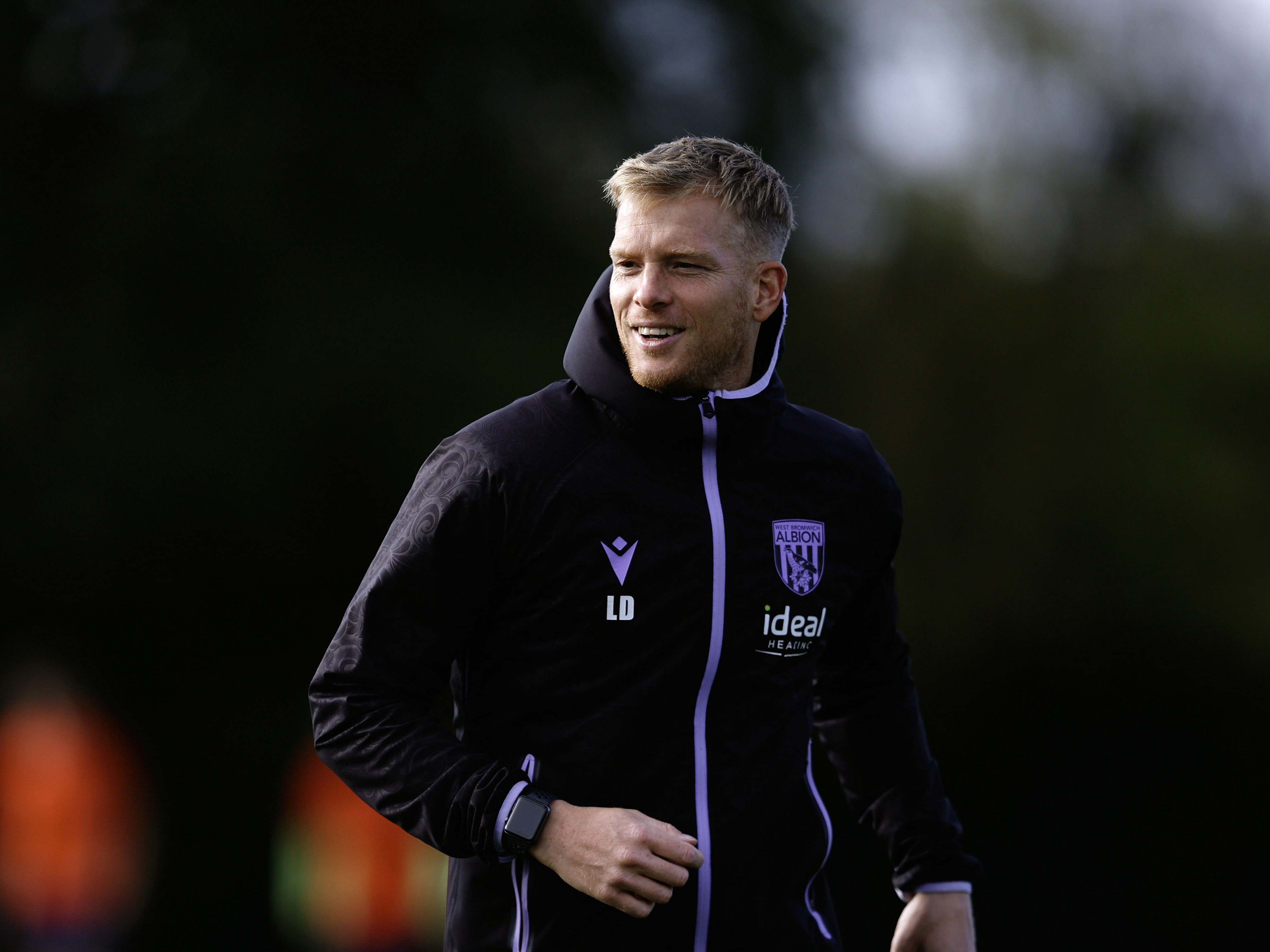 Albion U18 boss Leigh Downing smiling in training 