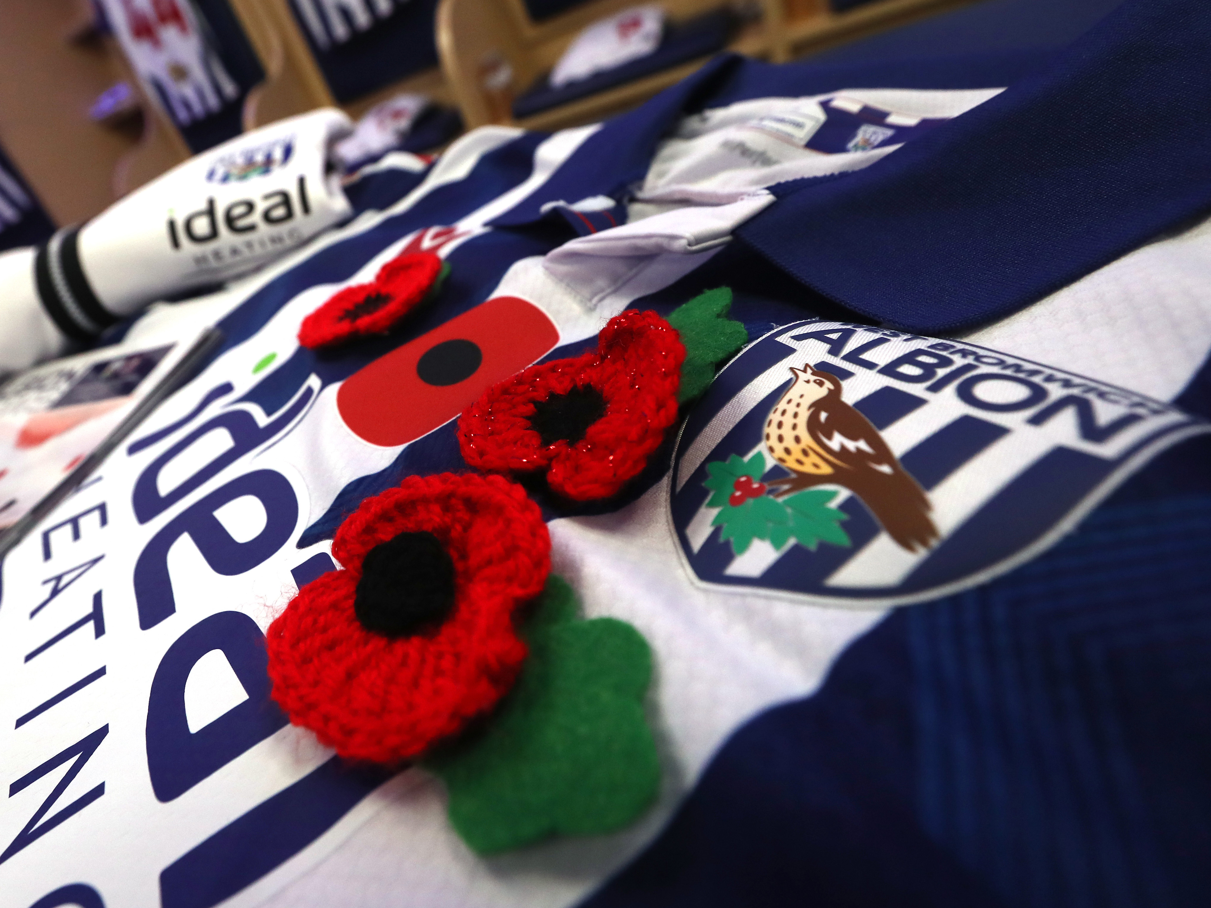 Poppies on an Albion home shirt laying in the dressing room