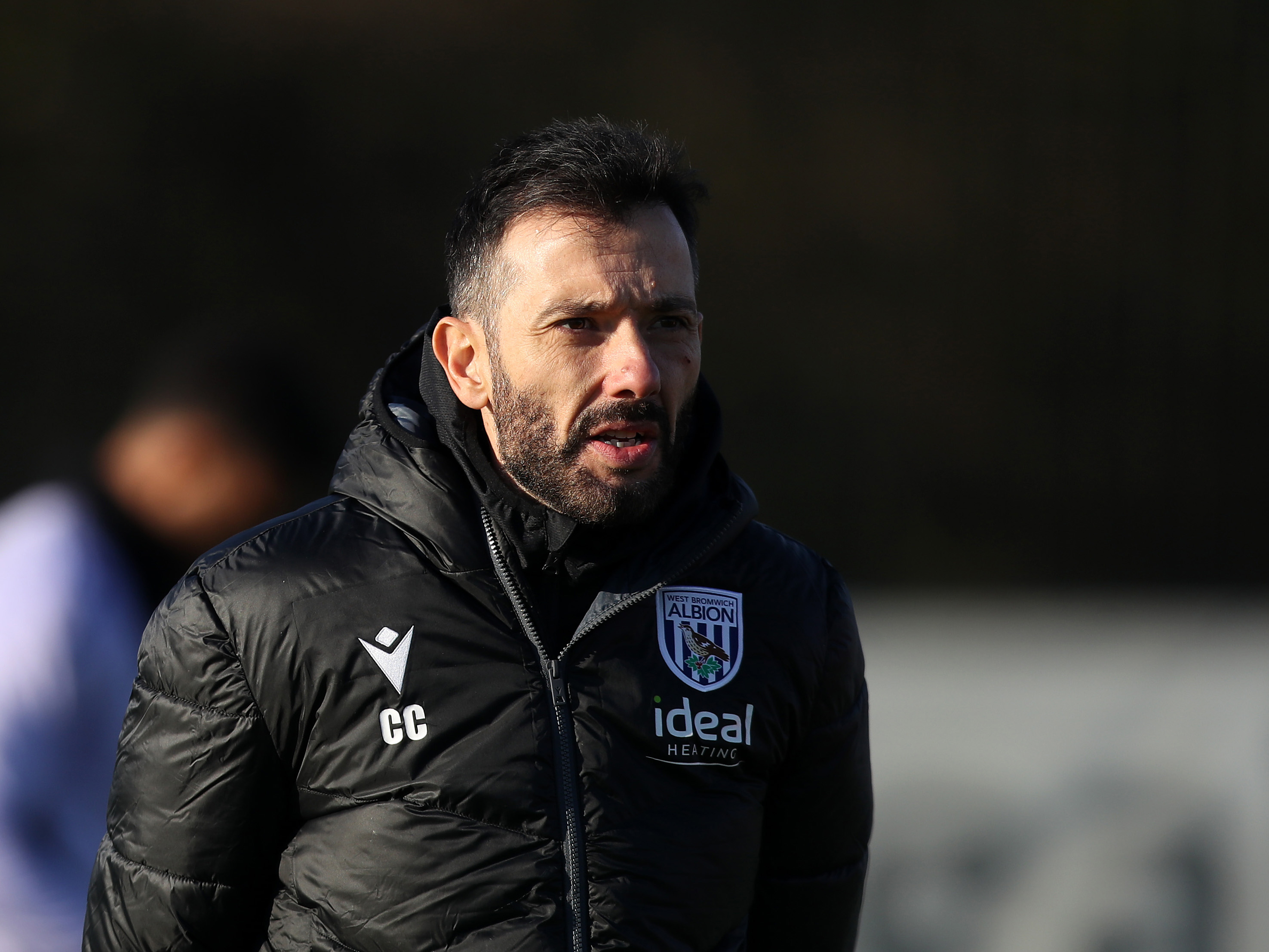 Carlos Corberán during a training session with a black coat on 