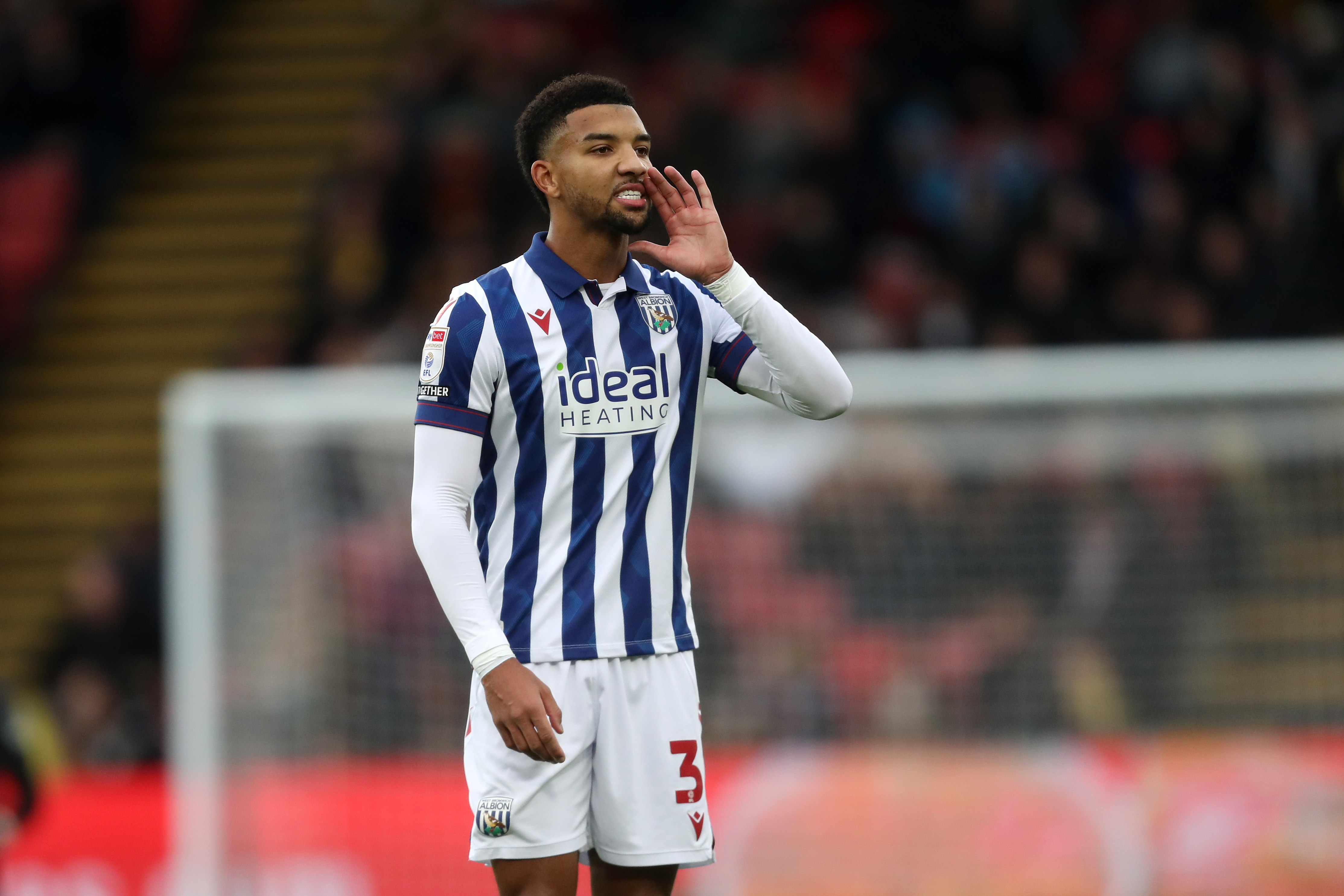 Mason Holgate shouting while wearing the home kit during a game 