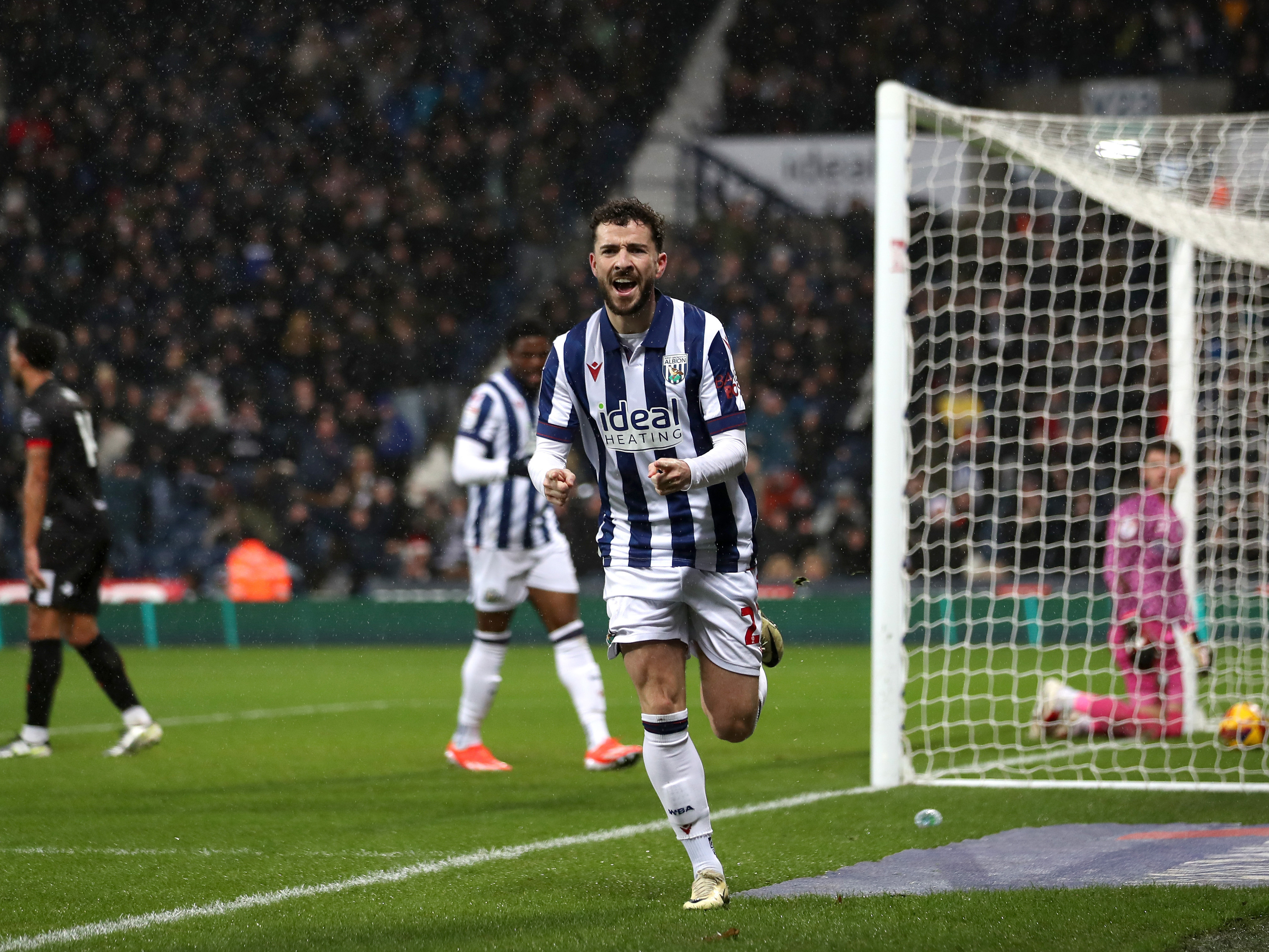 An image of Mikey Johnston celebrating his goal against Bristol City