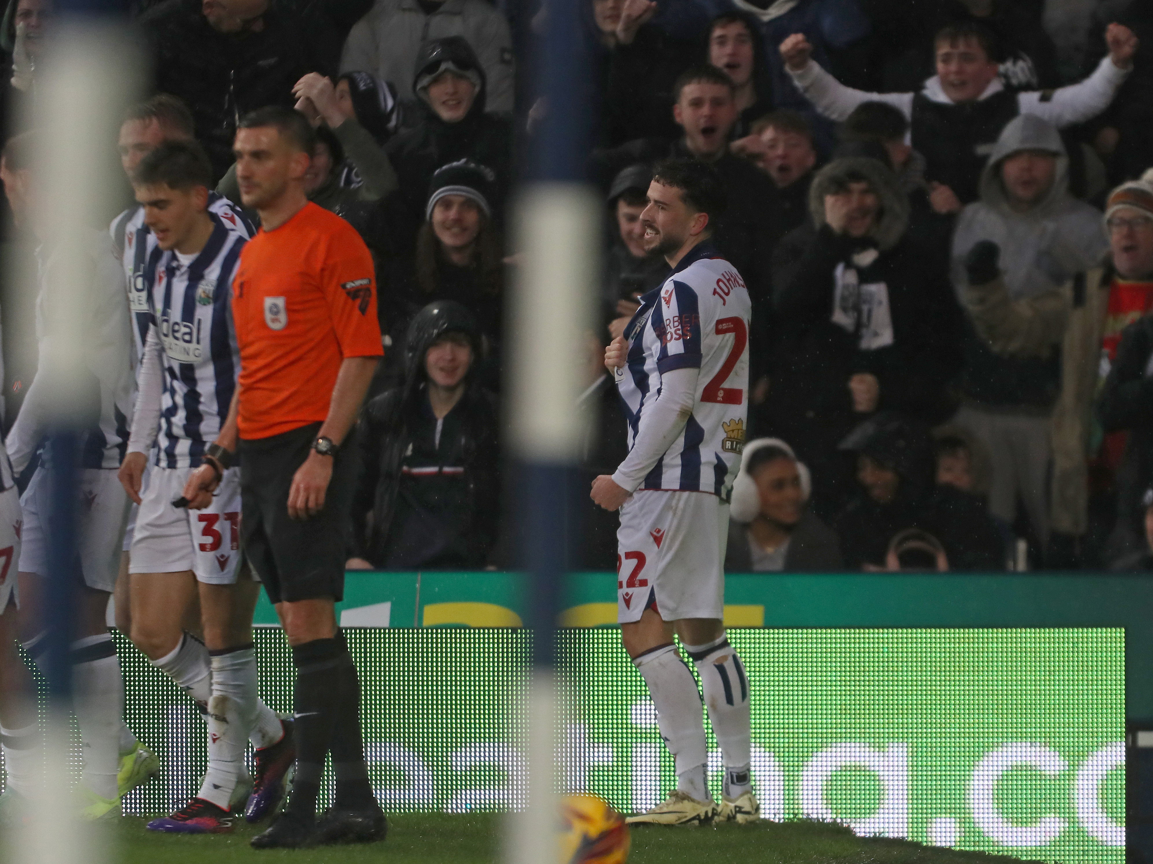 An image of Mikey Johnston celebrating his goal against Bristol City