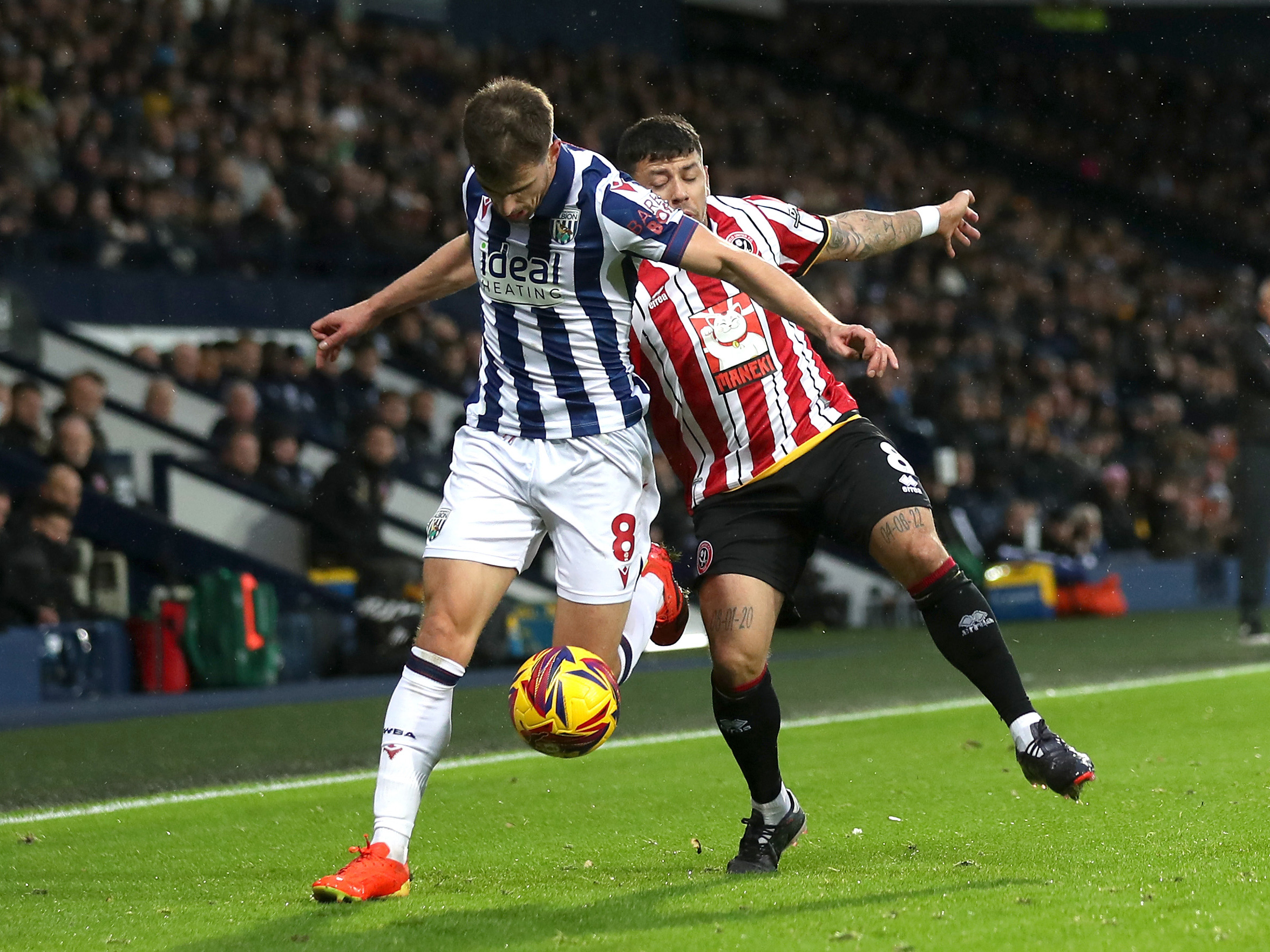 An image of Jayson Molumby battling for the ball against Sheffield United