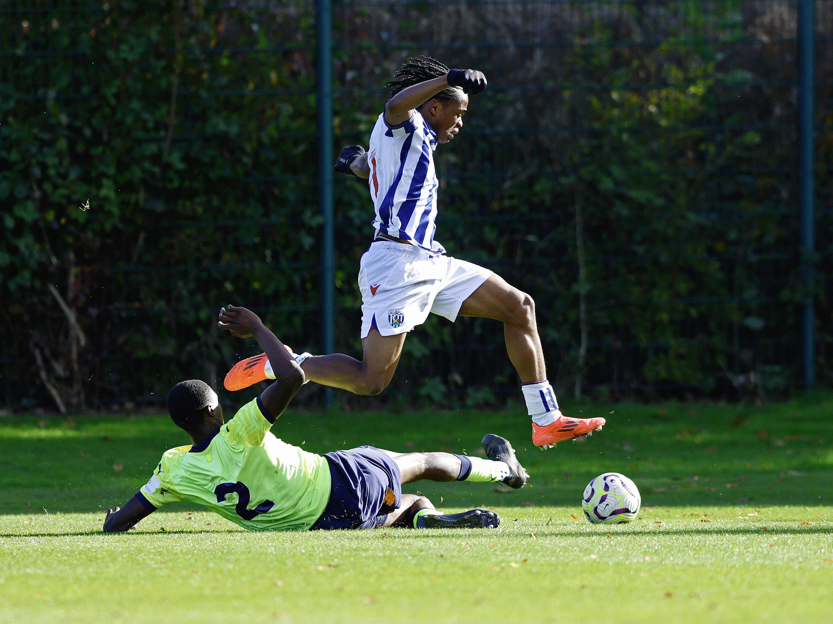 A photo of U18 attacker Divine Onyemachi in the 2024/25 home kit