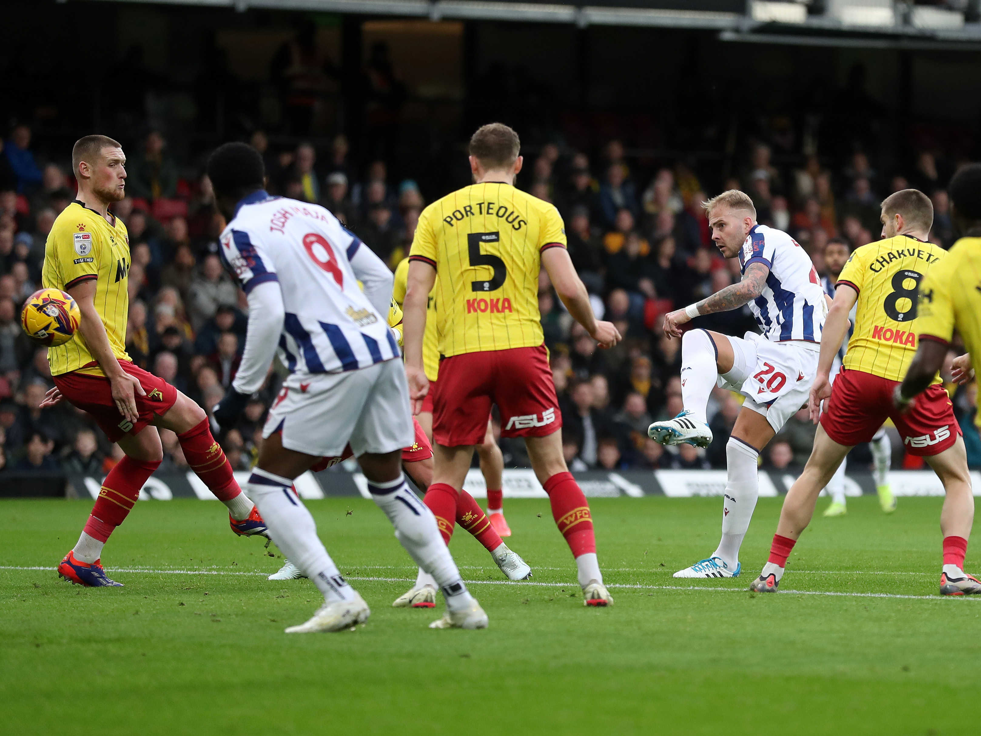 An image of Uros Racic shooting against Watford