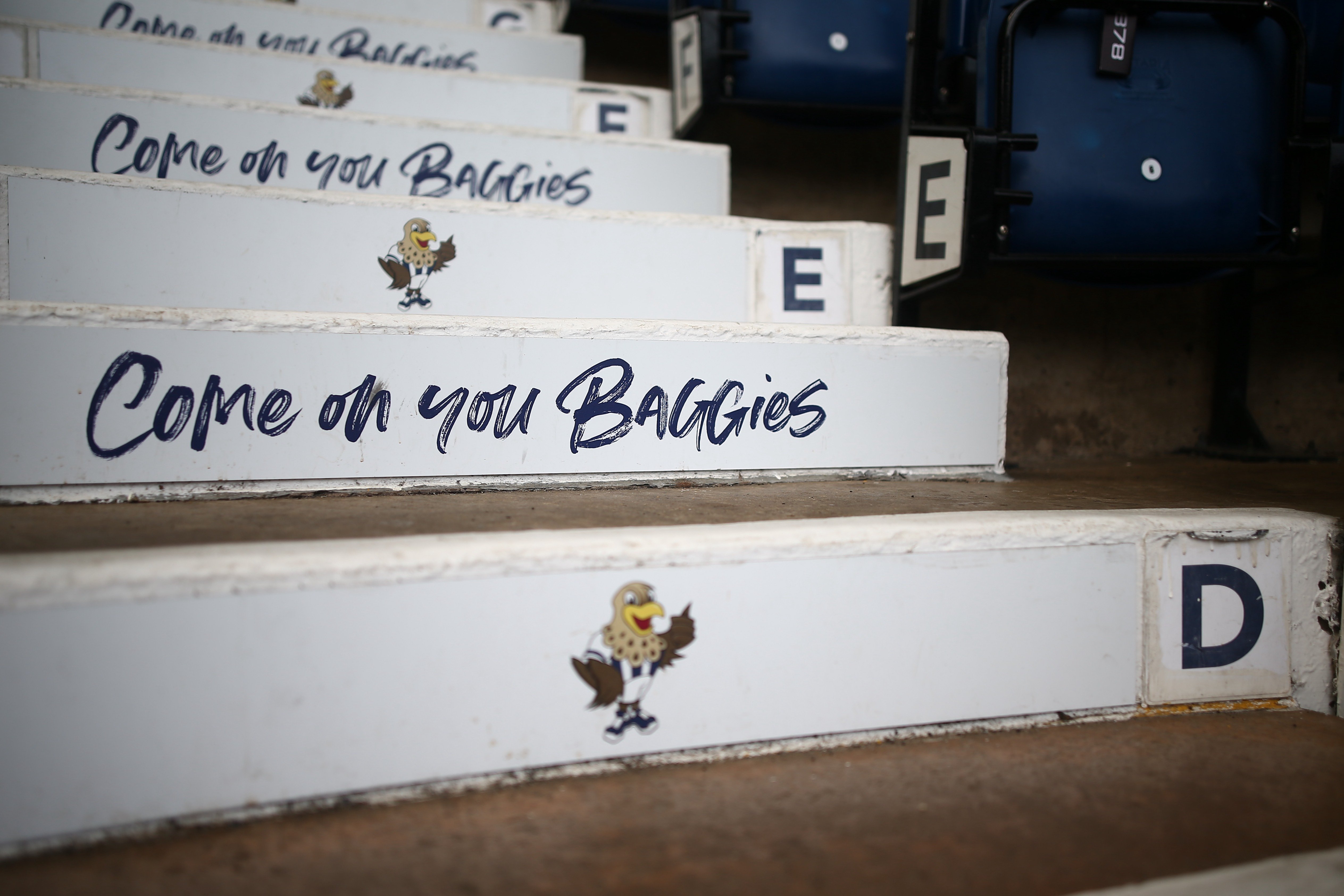 Steps at The Hawthorns in the stand with the words "Come on you Baggies" printed on