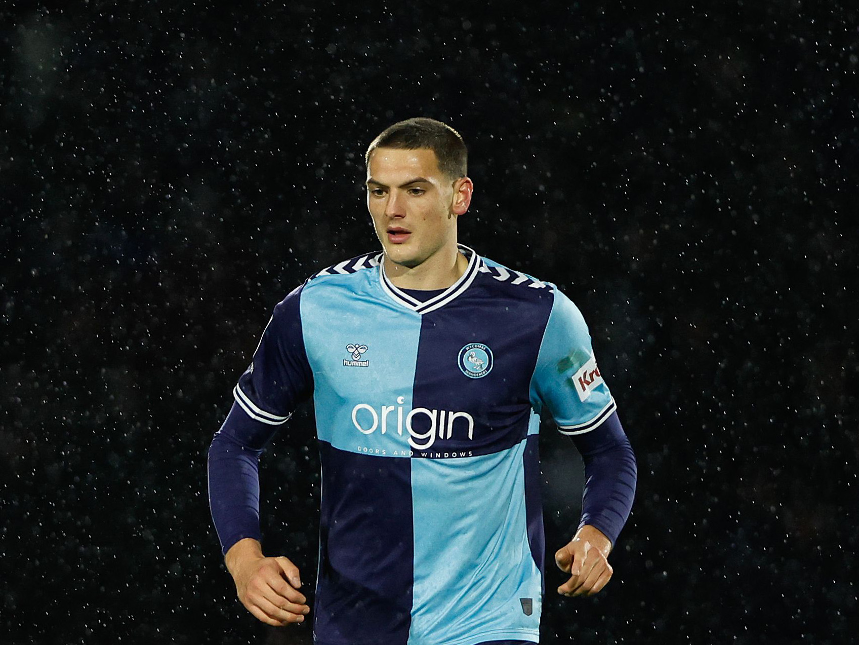 Caleb Taylor in action for Wycombe Wanderers in their home kit 