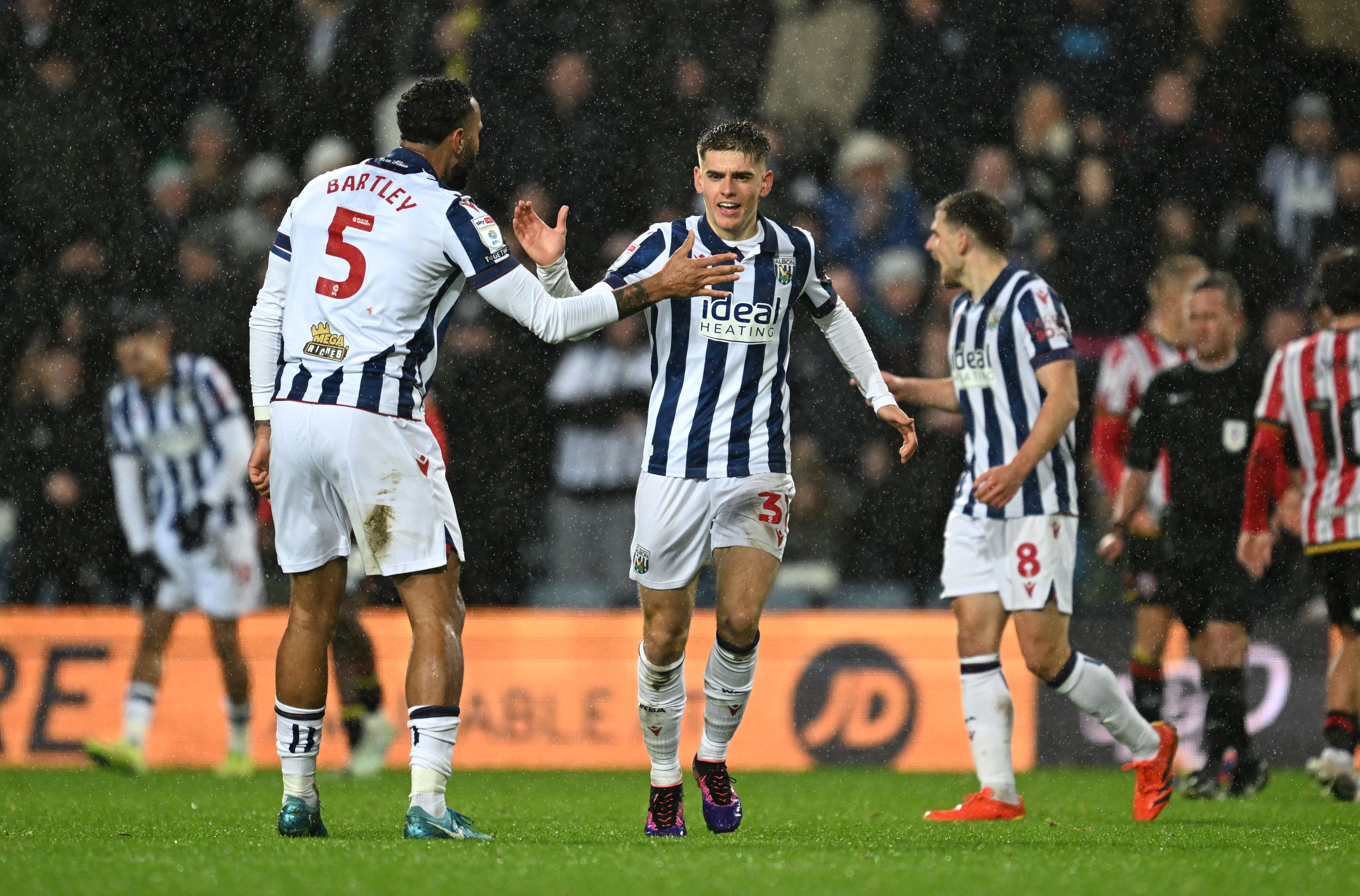 Tom Fellows celebrates scoring against Sheffield United with Kyle Bartley