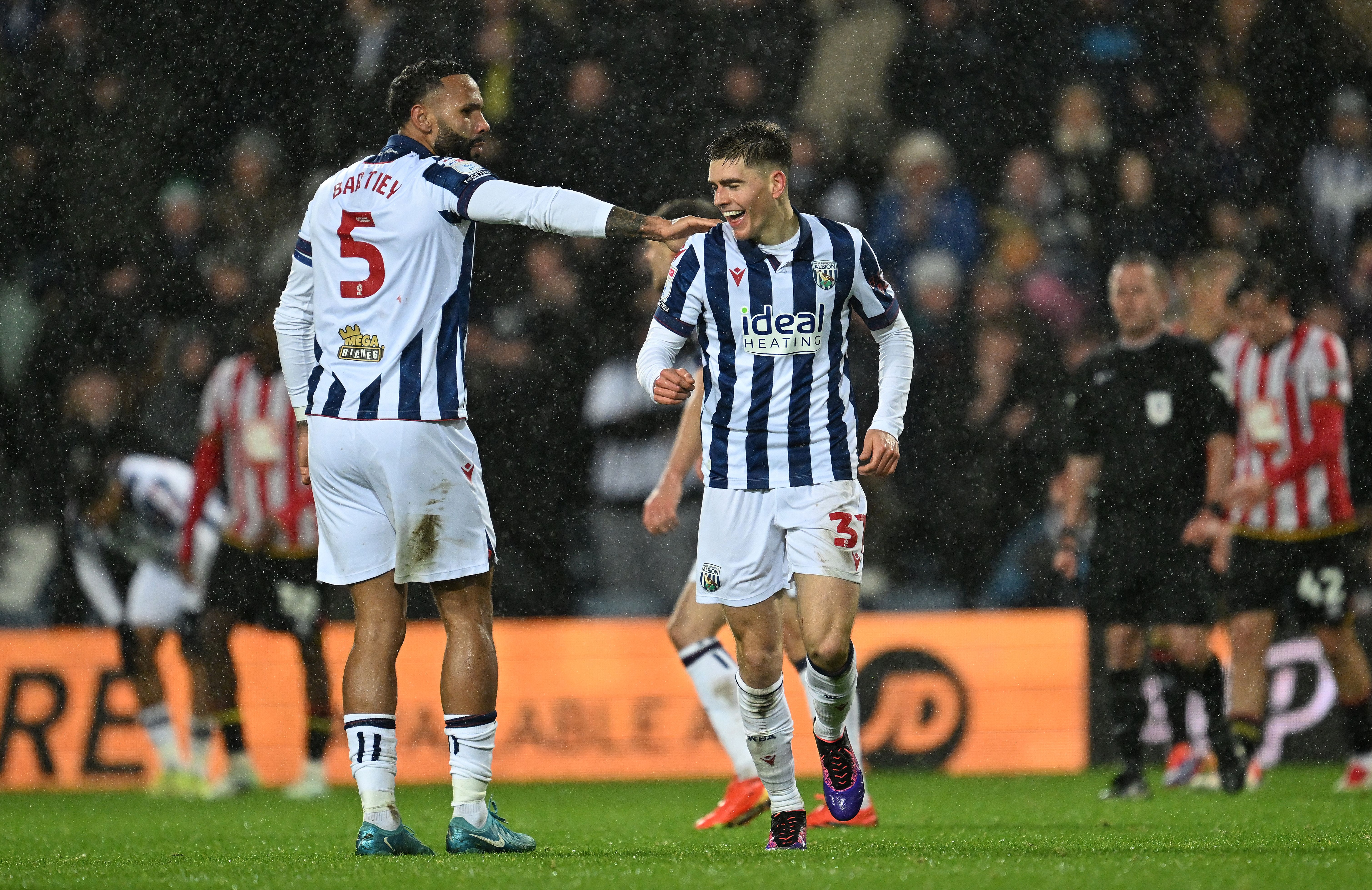 Tom Fellows celebrates scoring against Sheffield United with Kyle Bartley