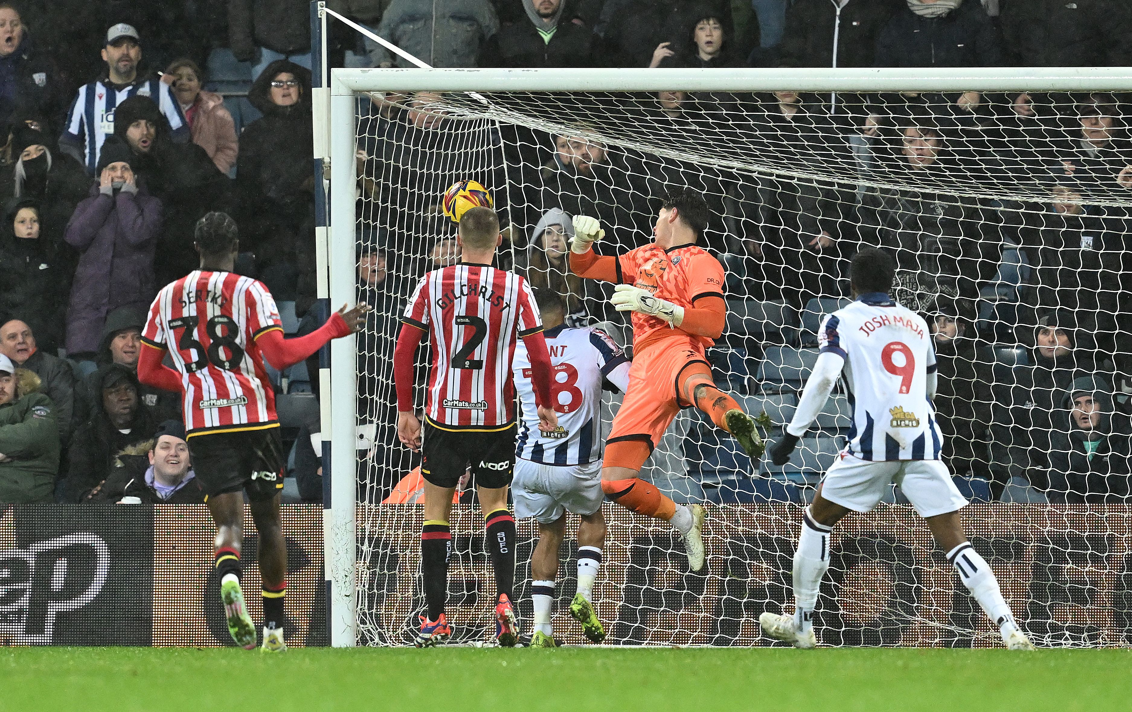 Tom Fellows' shot goes over the Sheffield United goalkeeper into the far corner 