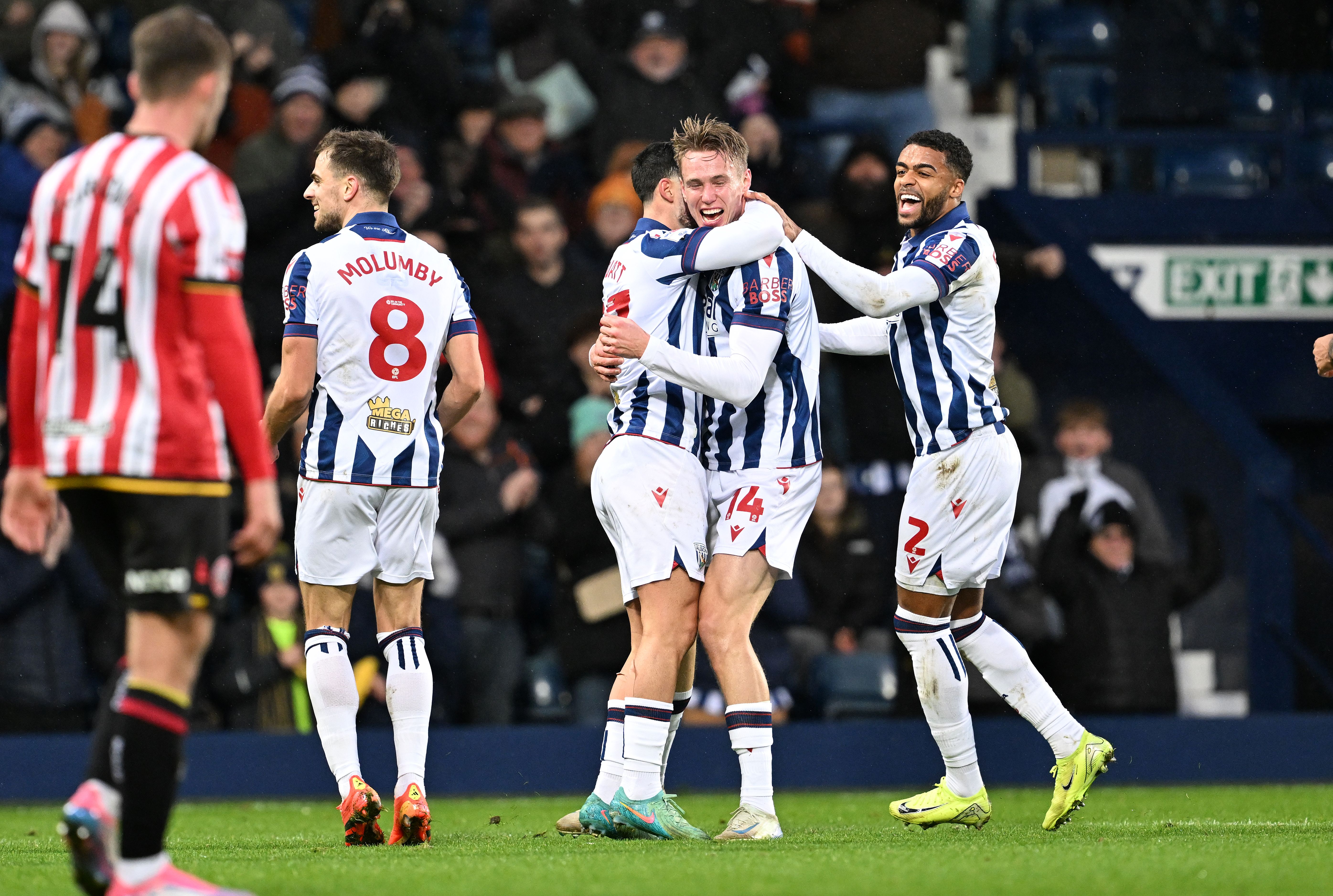 Torbjørn Heggem celebrates scoring a header against Sheffield United with team-mates 