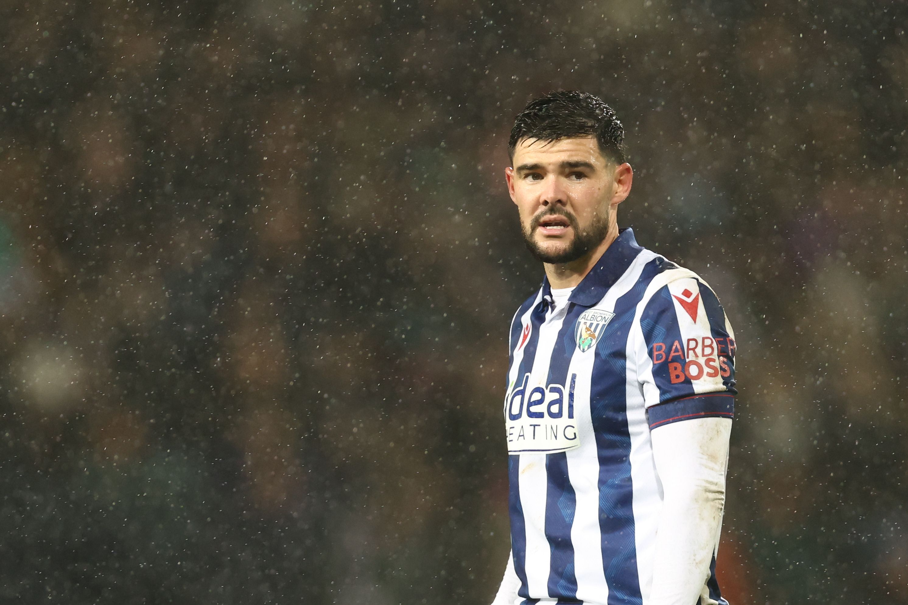 Alex Mowatt in action in the rain against Bristol City 