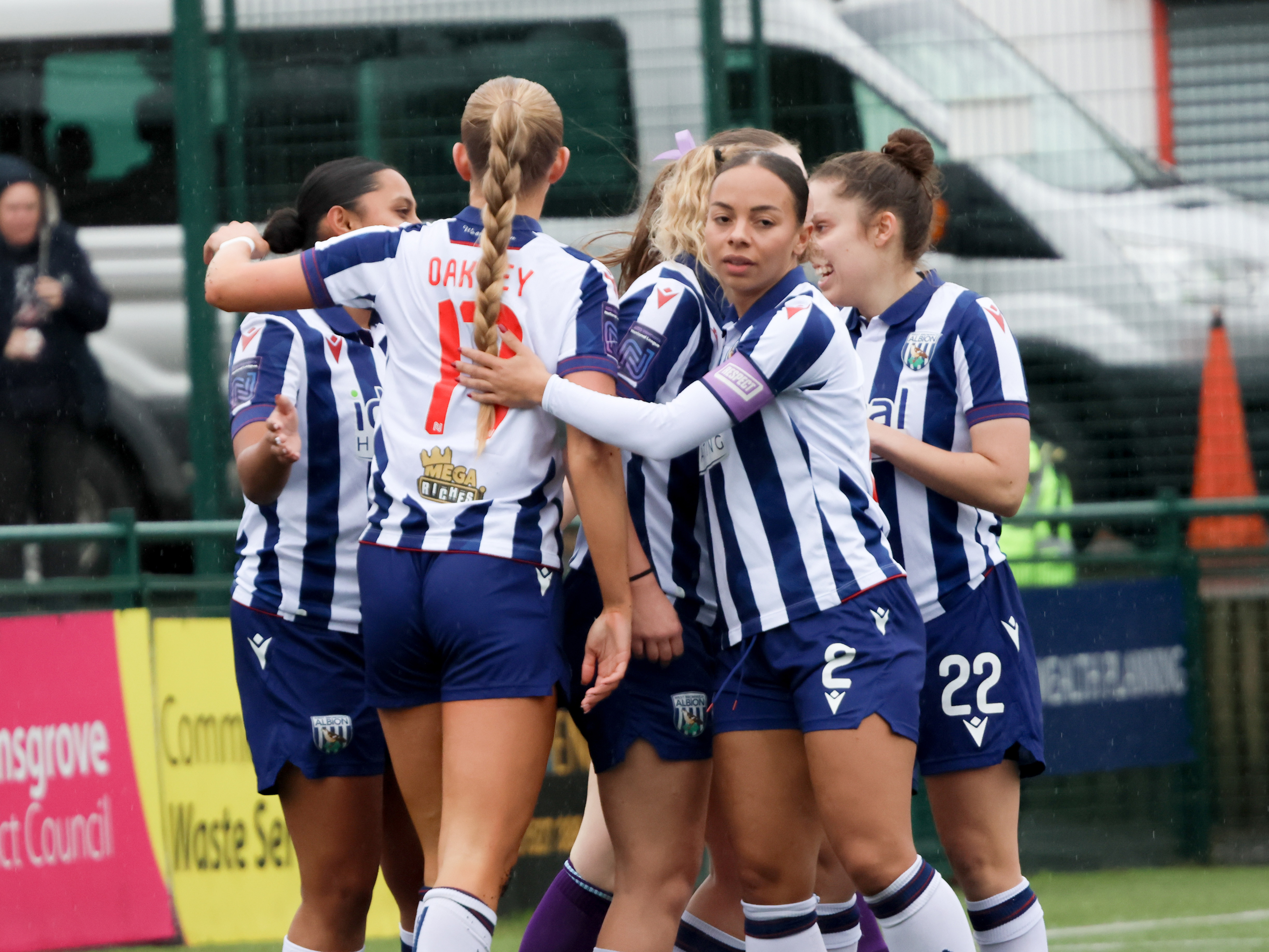 A general view of Albion Women players celebrating after a goal in the home kit 