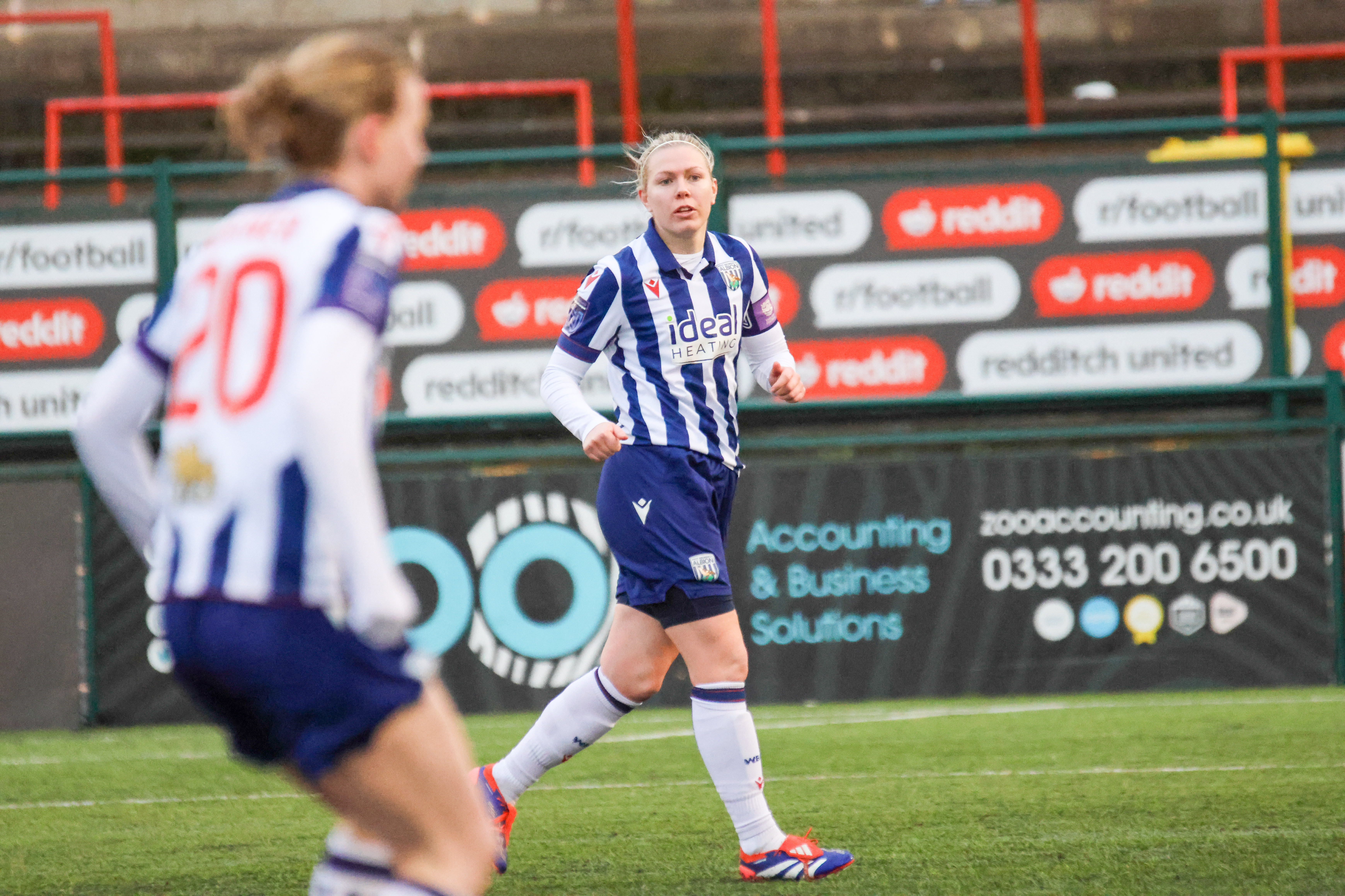 Hannah George in action for Albion Women while wearing the home kit