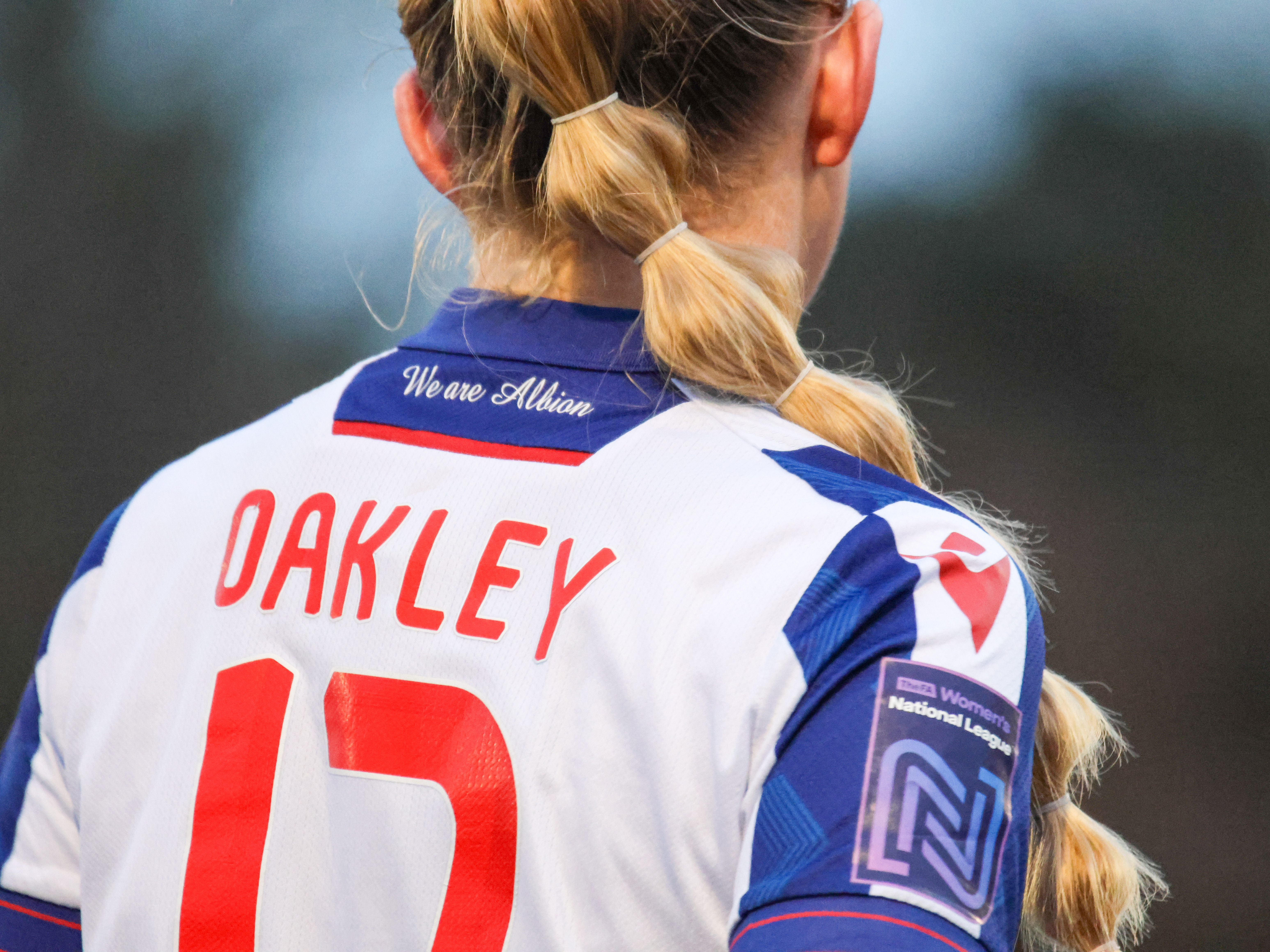 A close-up shot of Rhianne Oakley's name and number 17 on the back of her home shirt during a game