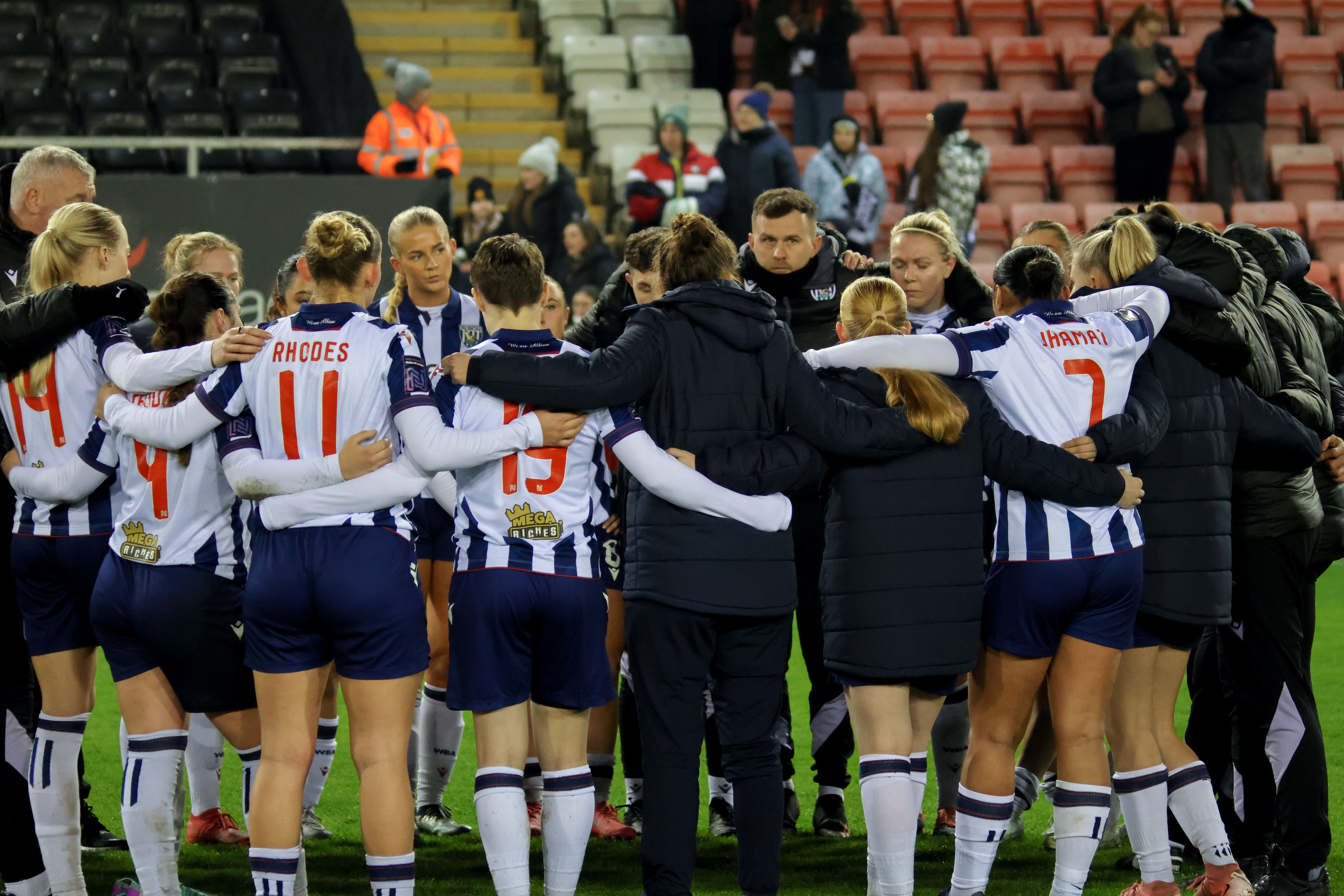 Albion Women in a huddle after the game at Man United