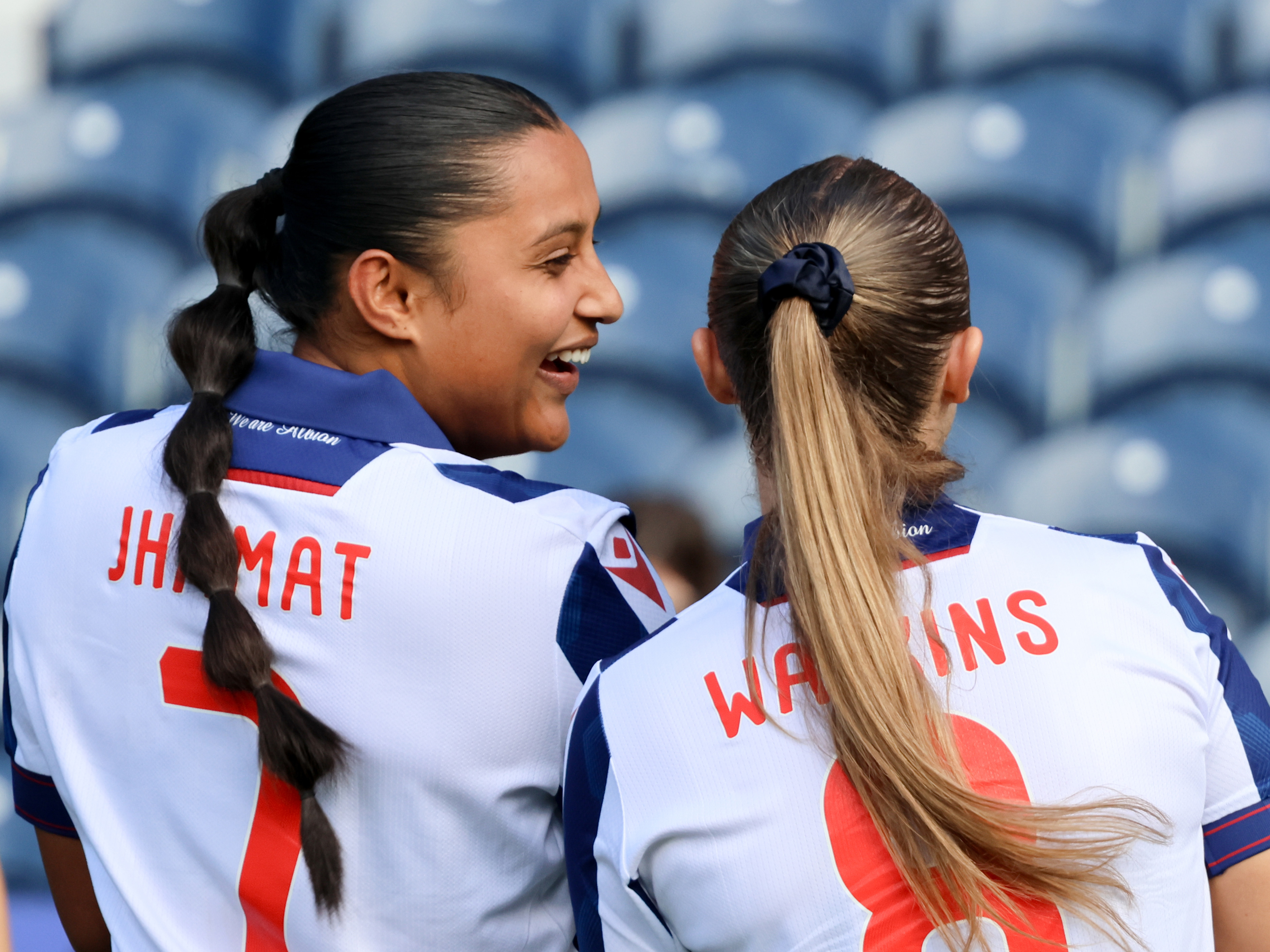 Simran Jhamat and Seren Watkins laughing in the home kit 