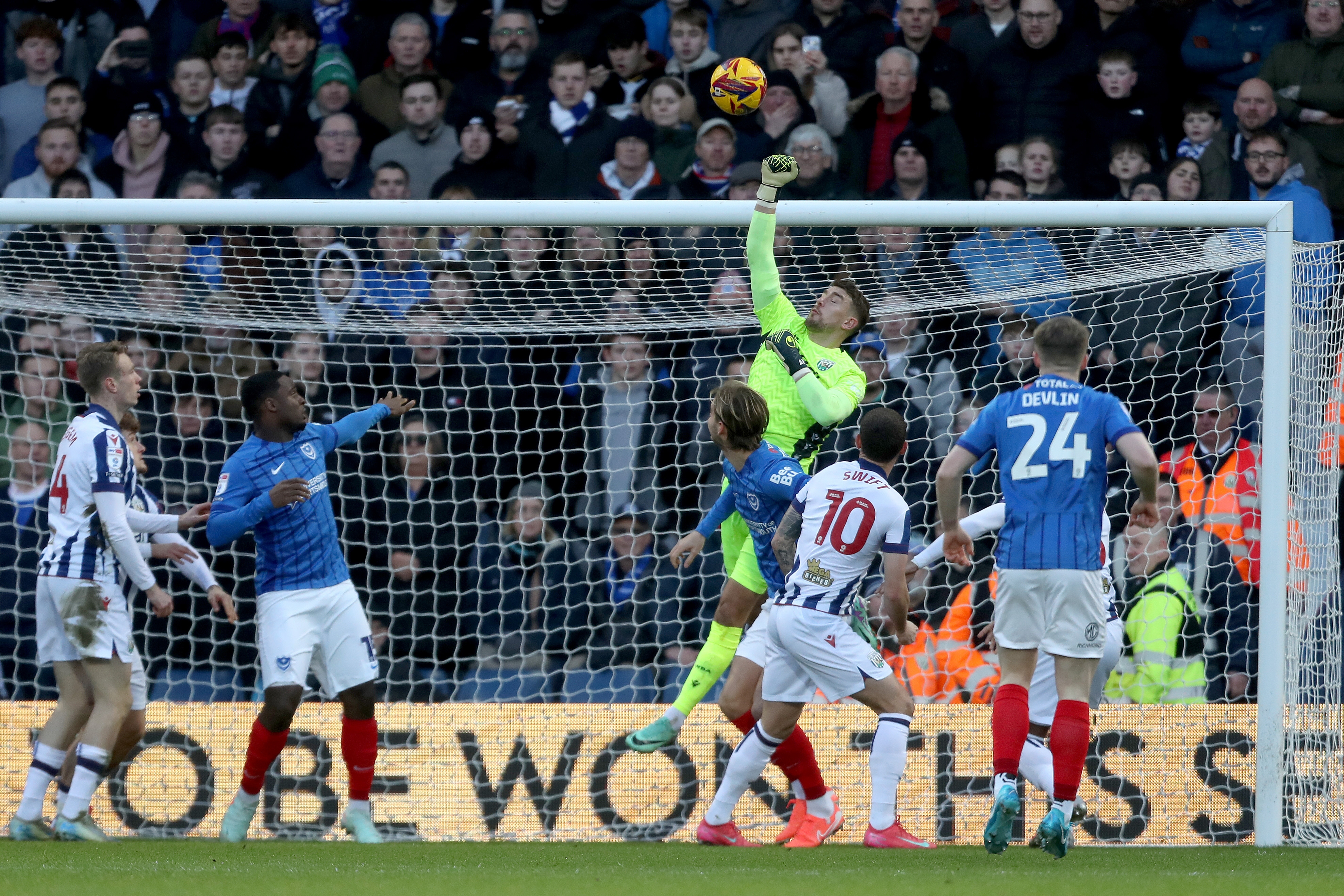 Alex Palmer punching the ball against Portsmouth 