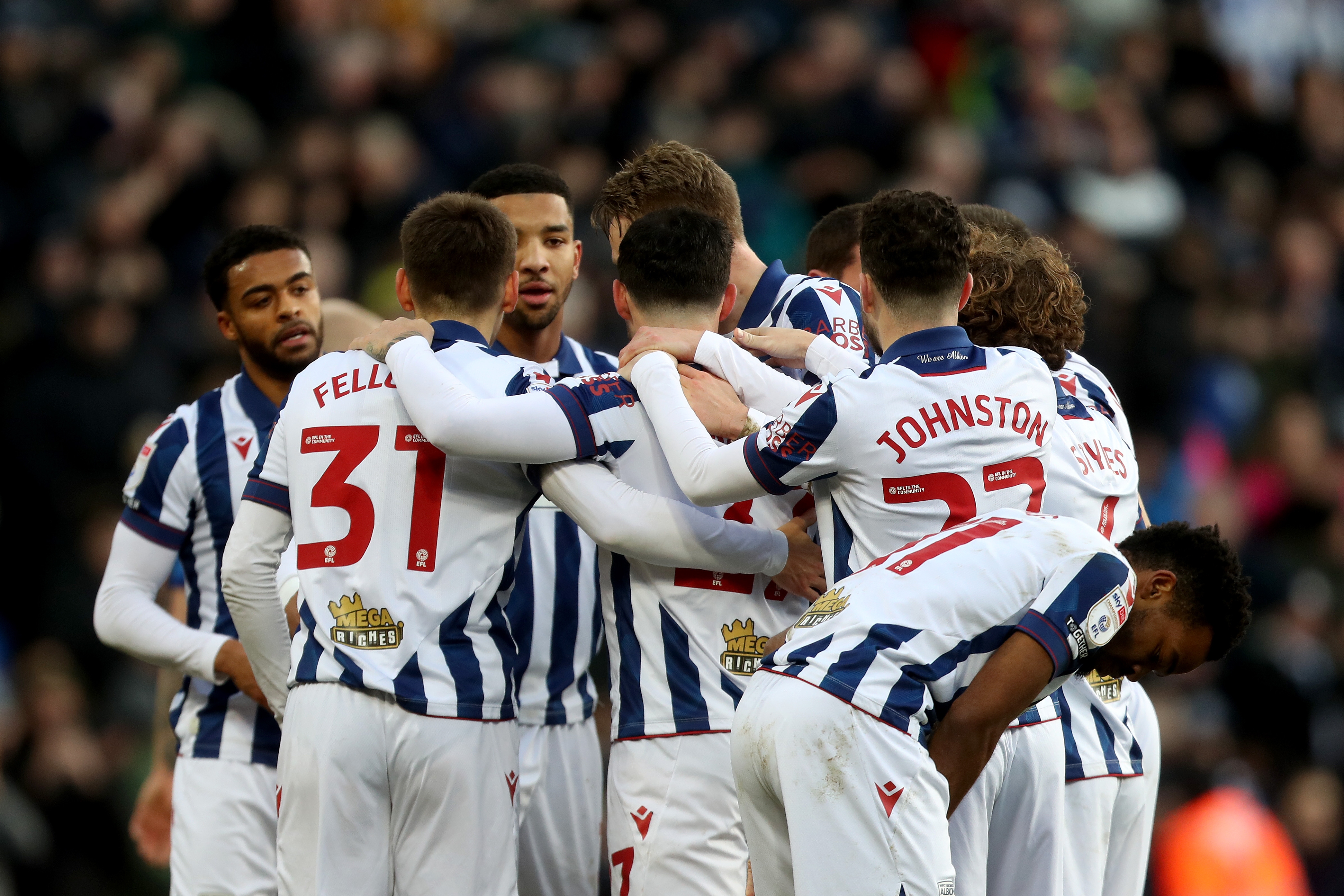 Alex Mowatt celebrates with team-mates after scoring against Portsmouth