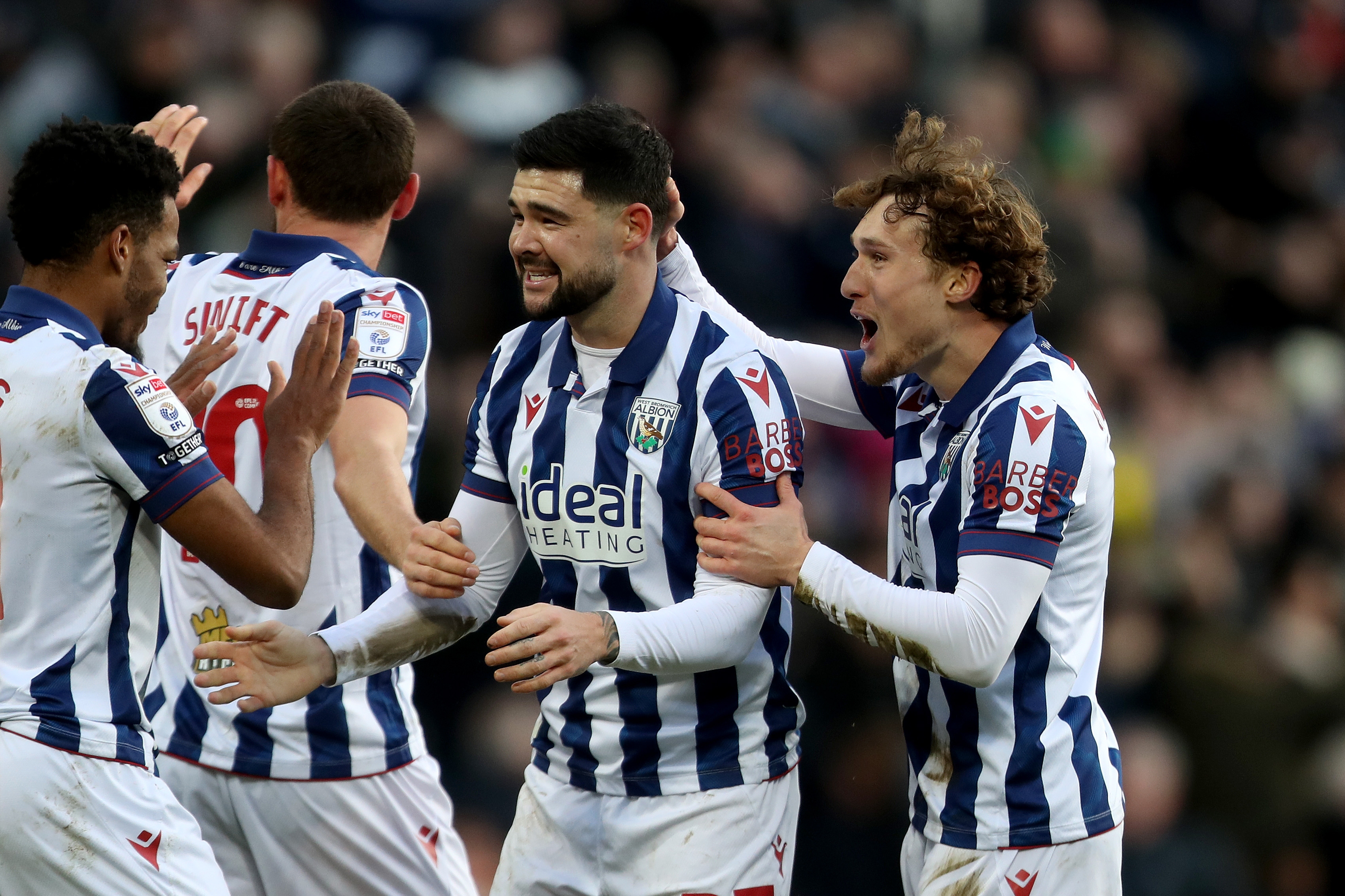 Alex Mowatt celebrates with team-mates after scoring against Portsmouth