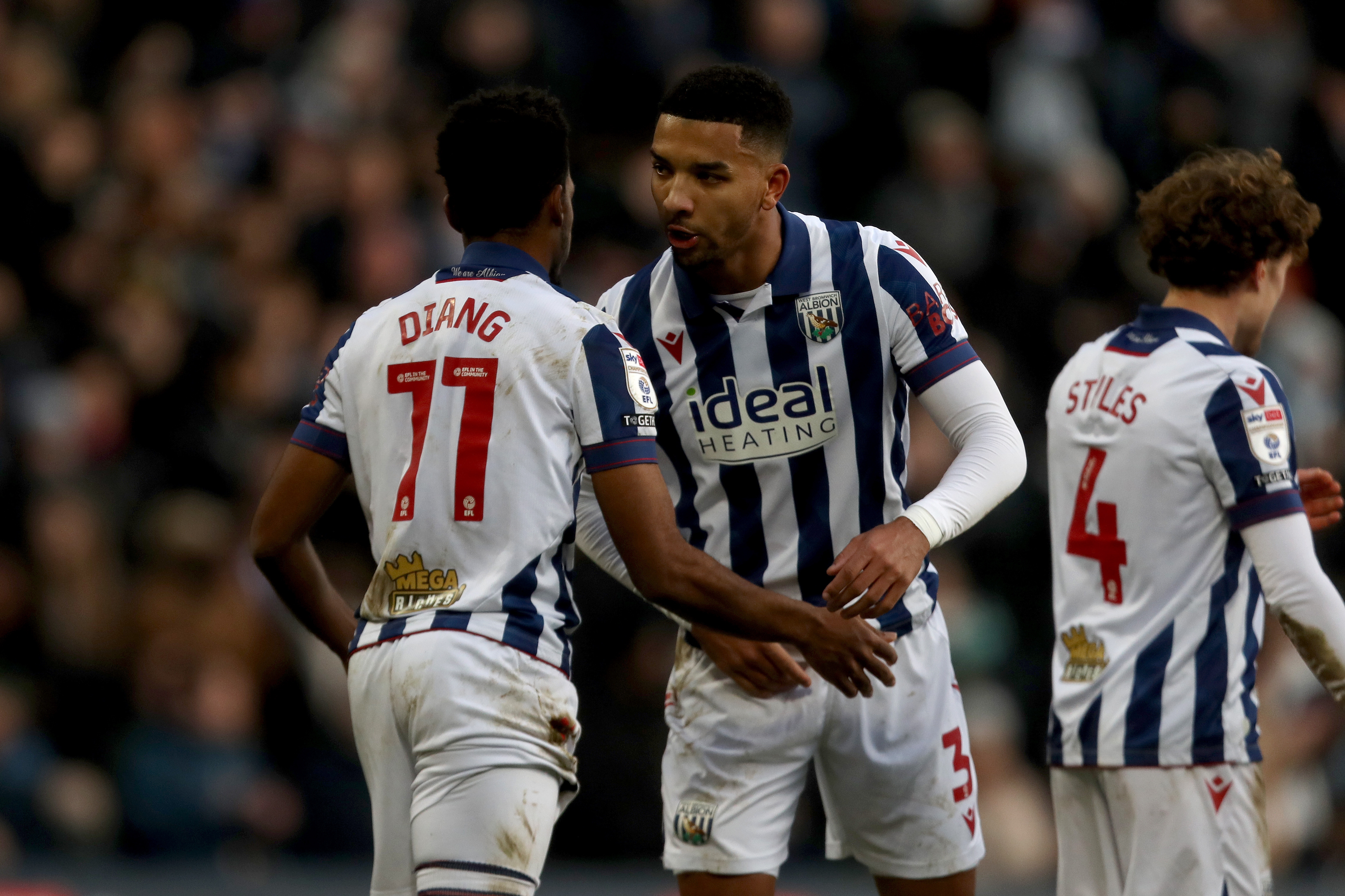 Grady Diangana celebrates with Mason Holgate after scoring against Portsmouth