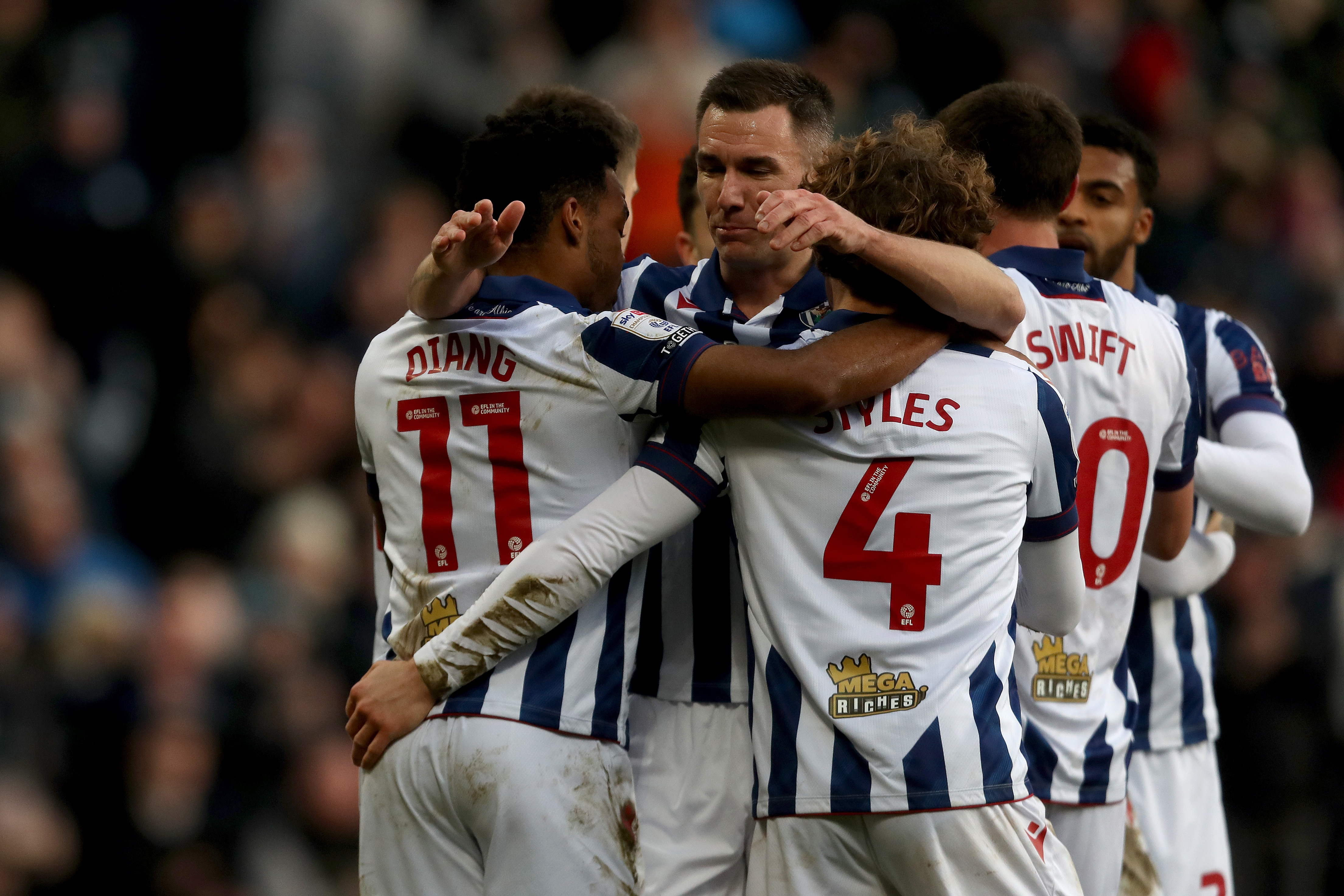 Grady Diangana celebrates with team-mates after scoring against Portsmouth