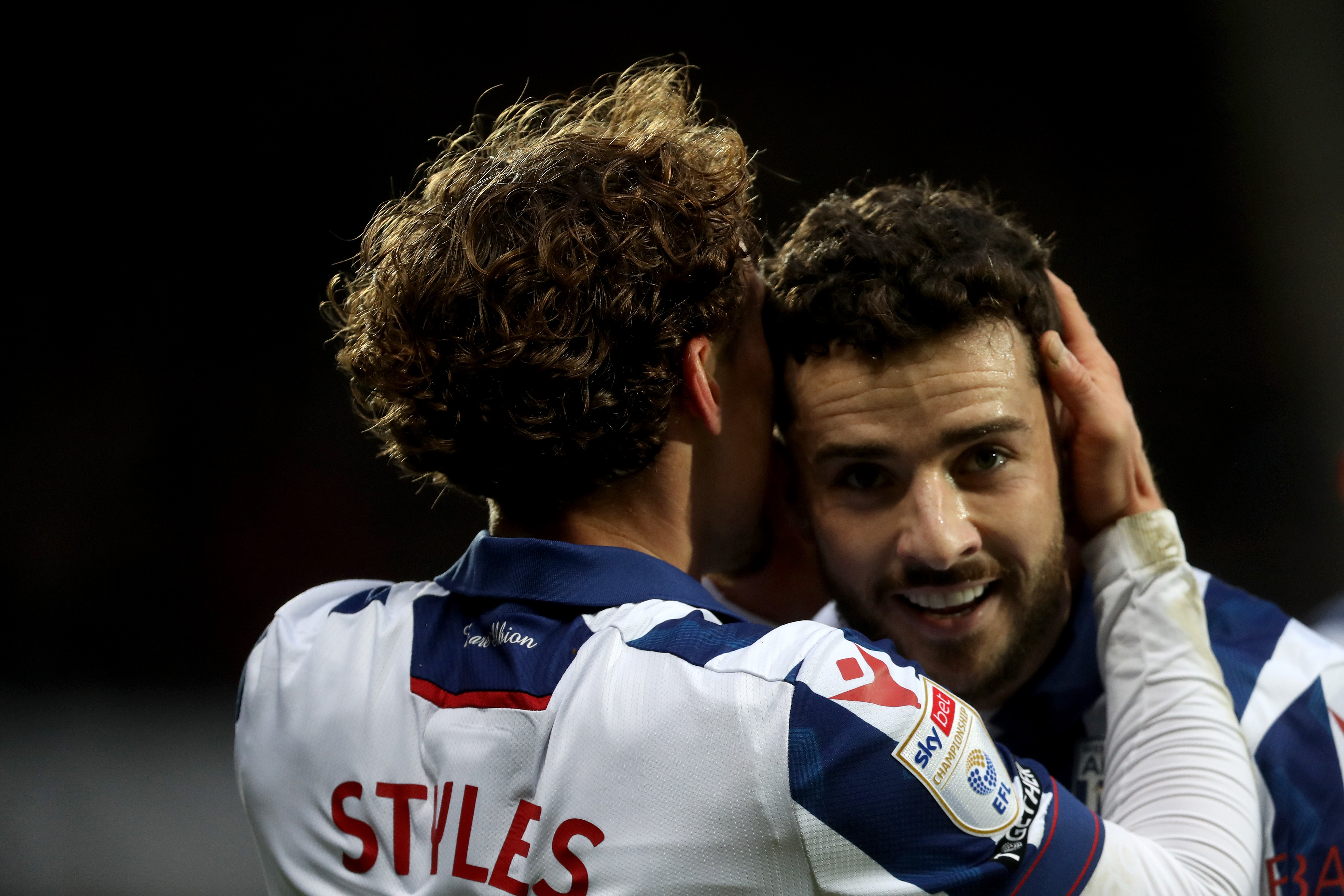 Callum Styles celebrates scoring against Preston with Mikey Johnston 