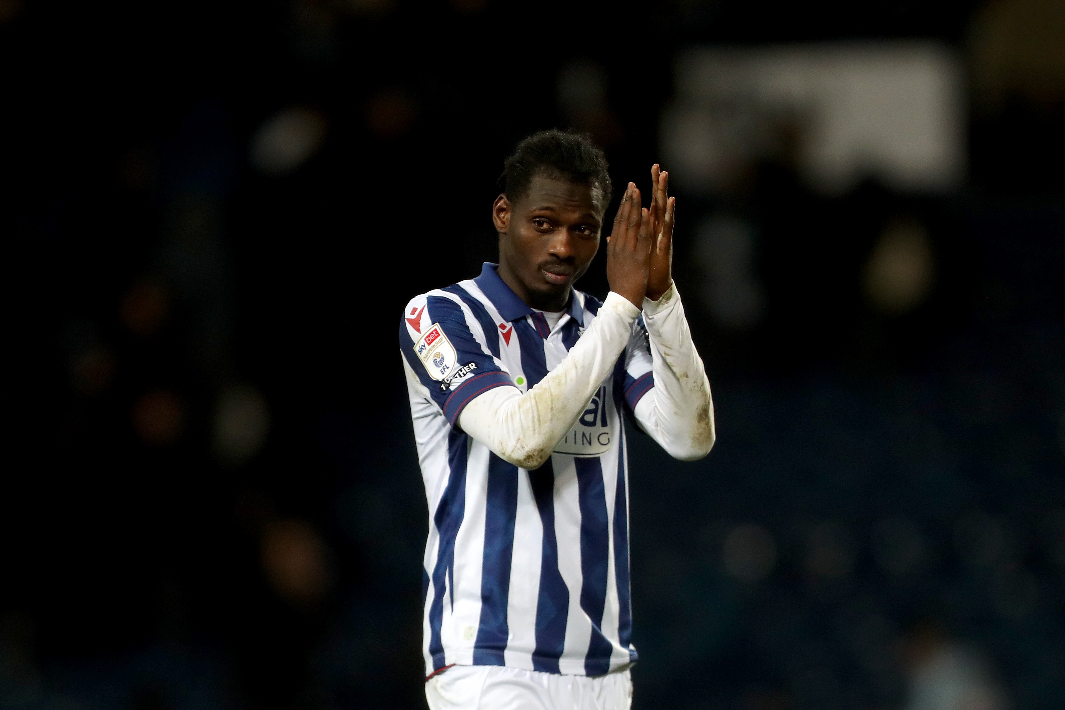 Ousmane Diakité applauding Albion fans after the win over Preston