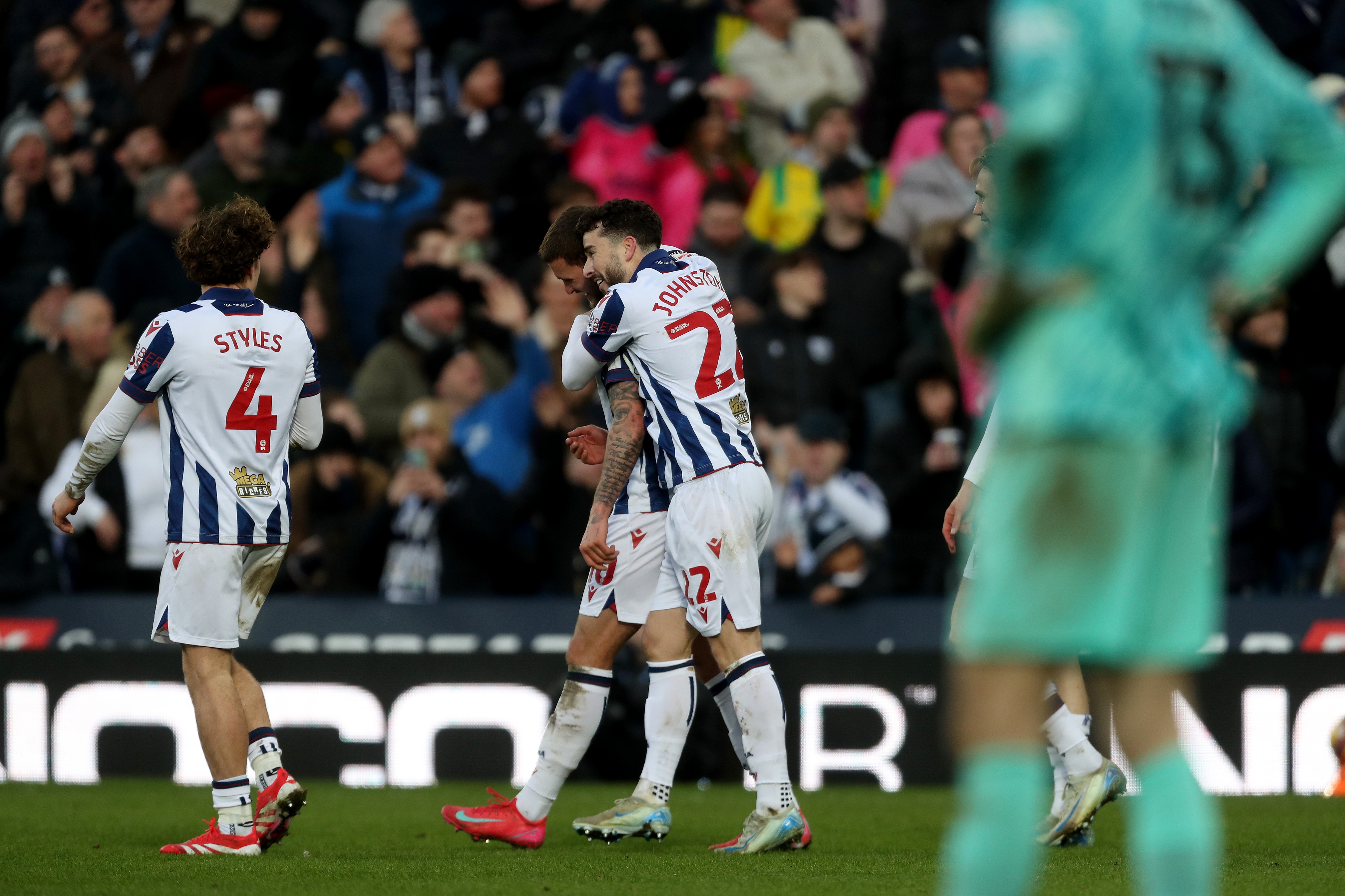 John Swift celebrates scoring against Portsmouth with Mikey Johnston