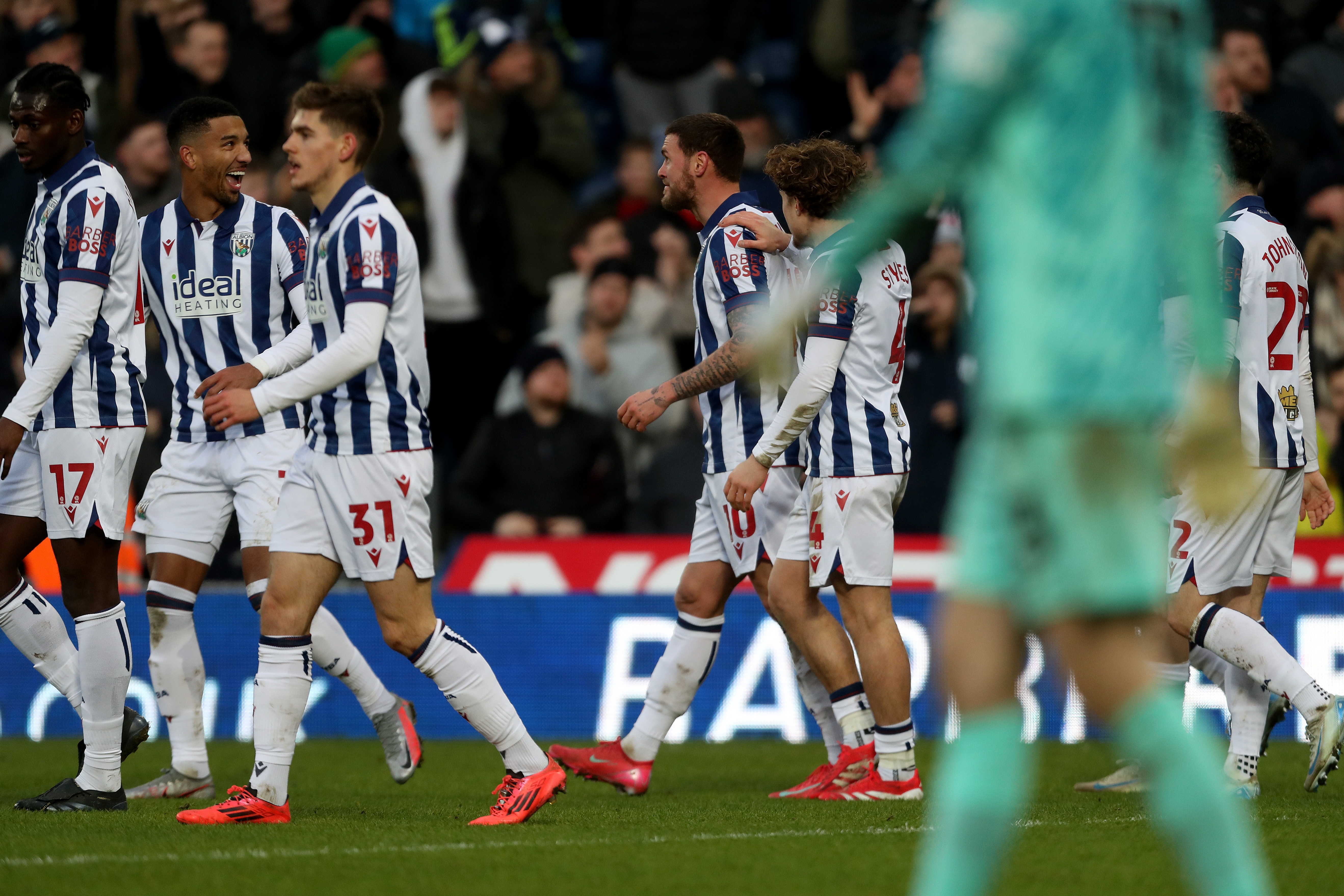 John Swift celebrates scoring against Portsmouth with team-mates