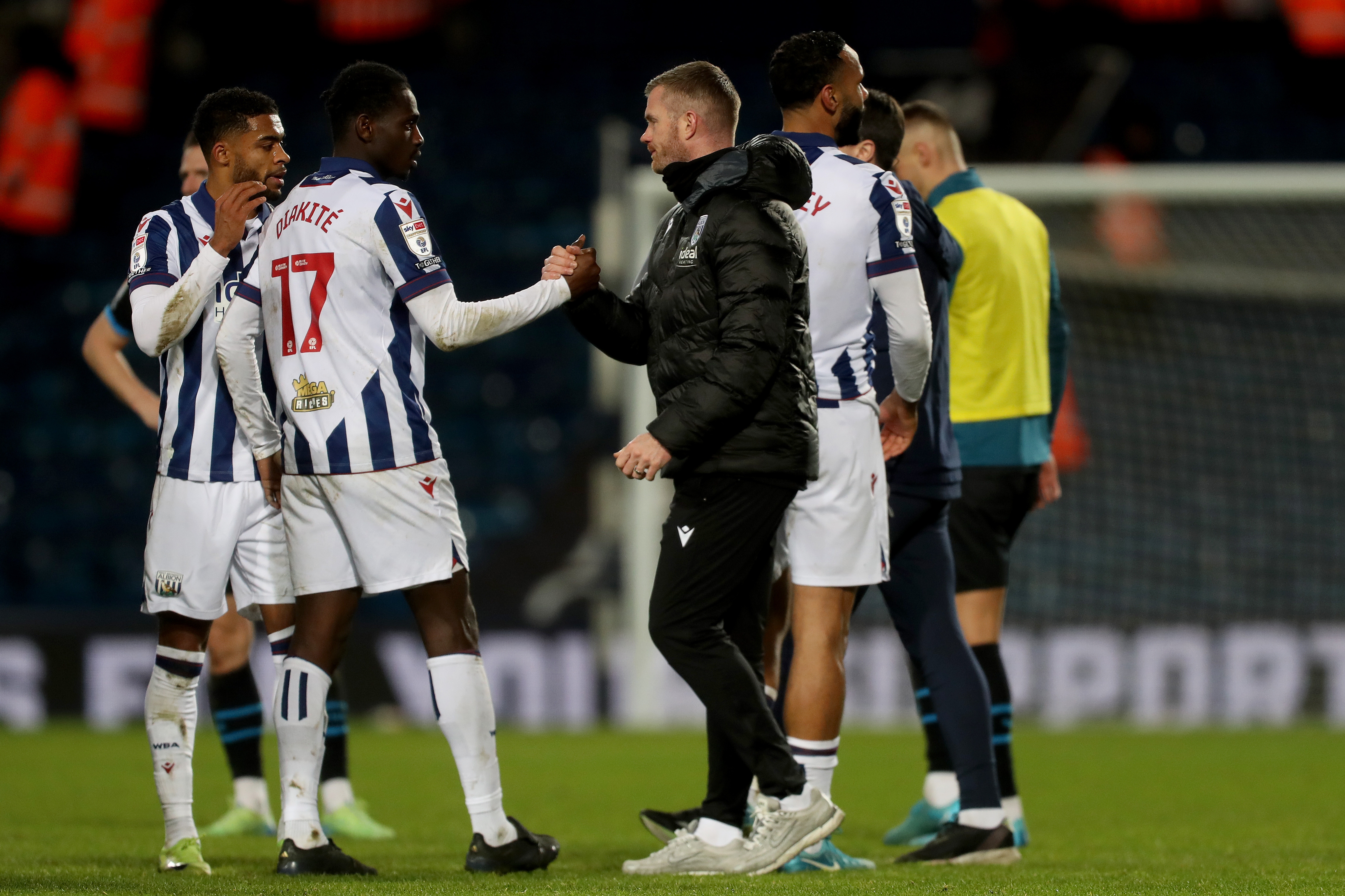 Chris Brunt shaking hands with Ousmane Diakité after the win over Preston