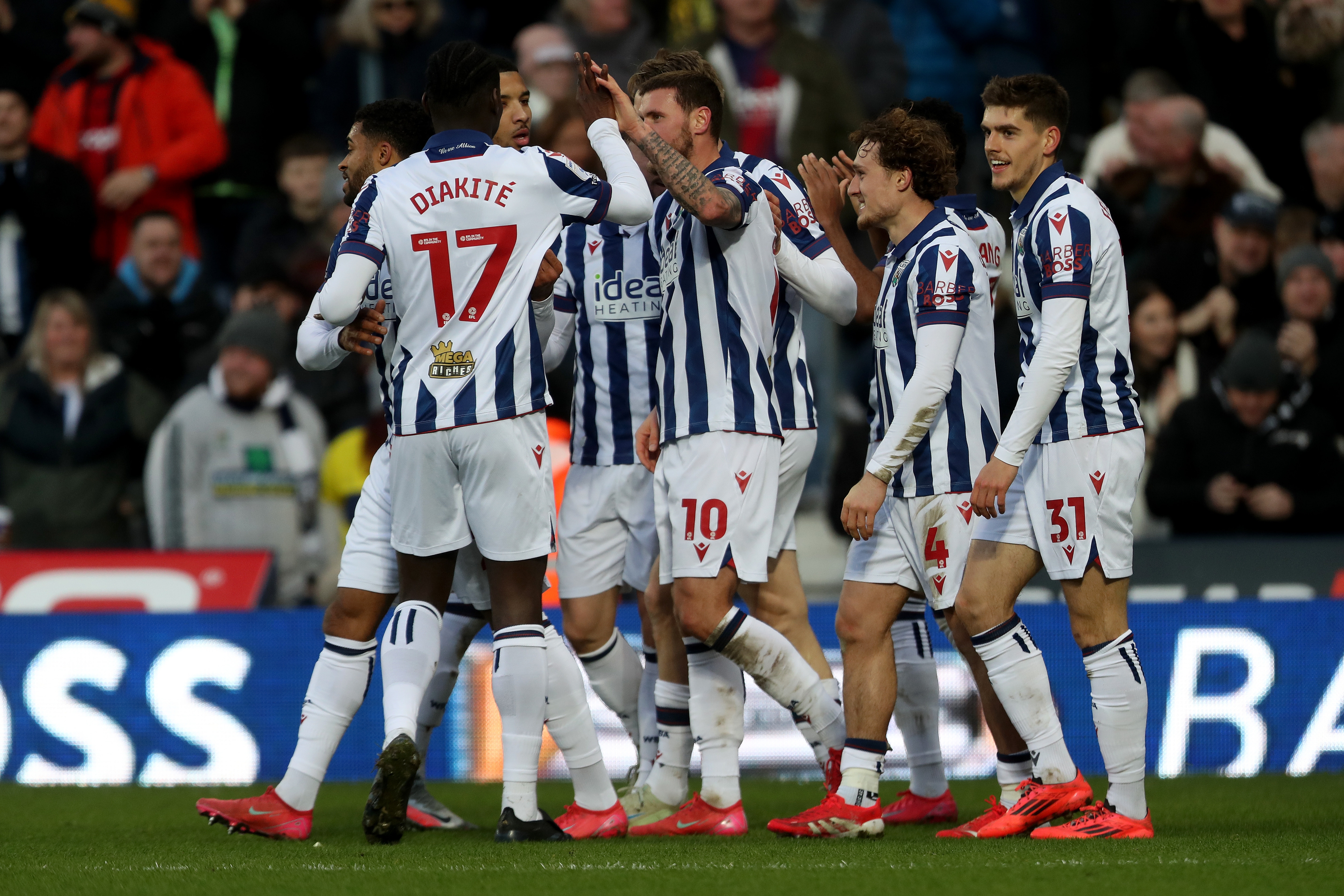 John Swift celebrates scoring against Portsmouth with team-mates