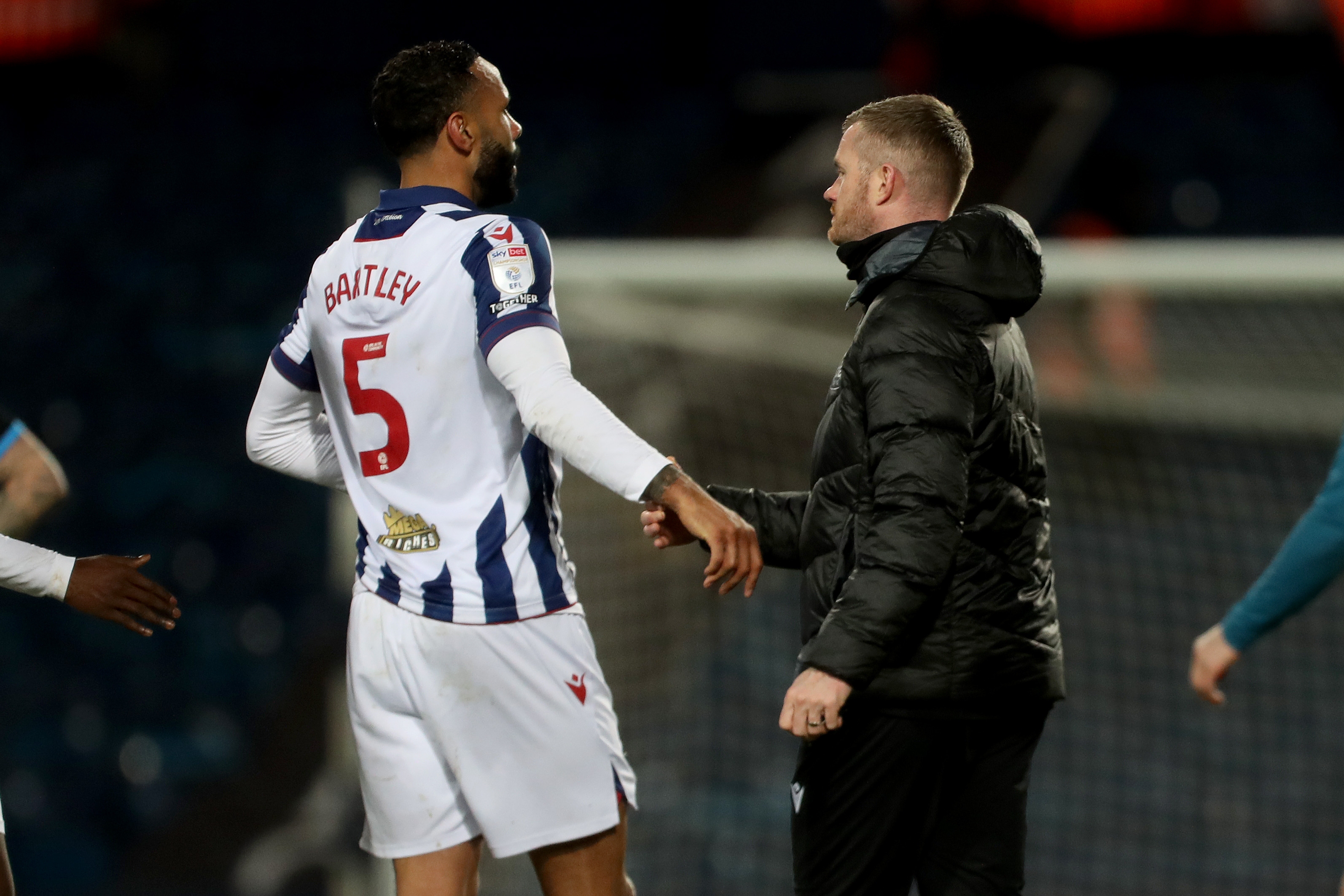 Chris Brunt and Kyle Bartley shaking hands after the win over Preston 