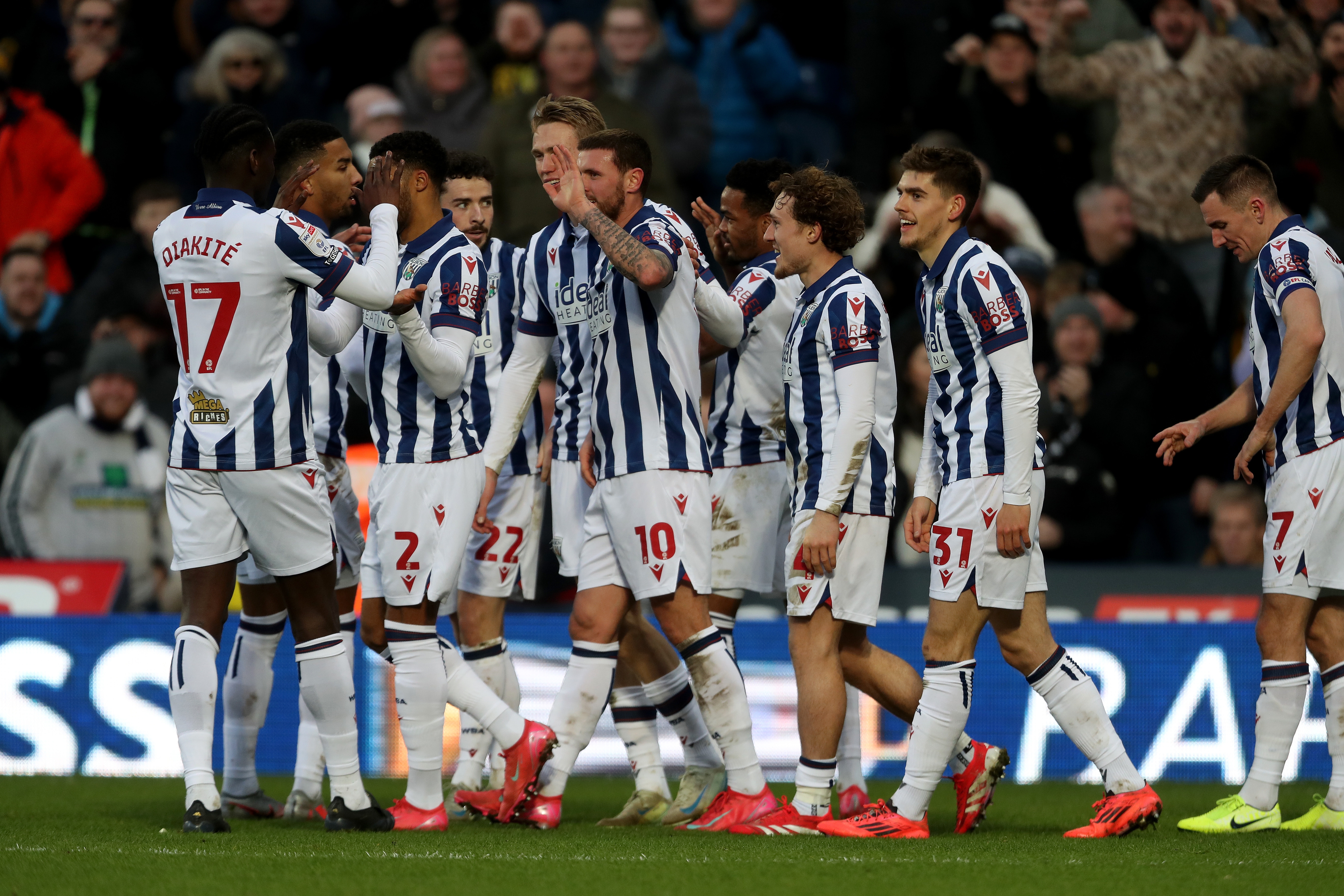 John Swift celebrates scoring against Portsmouth with team-mates