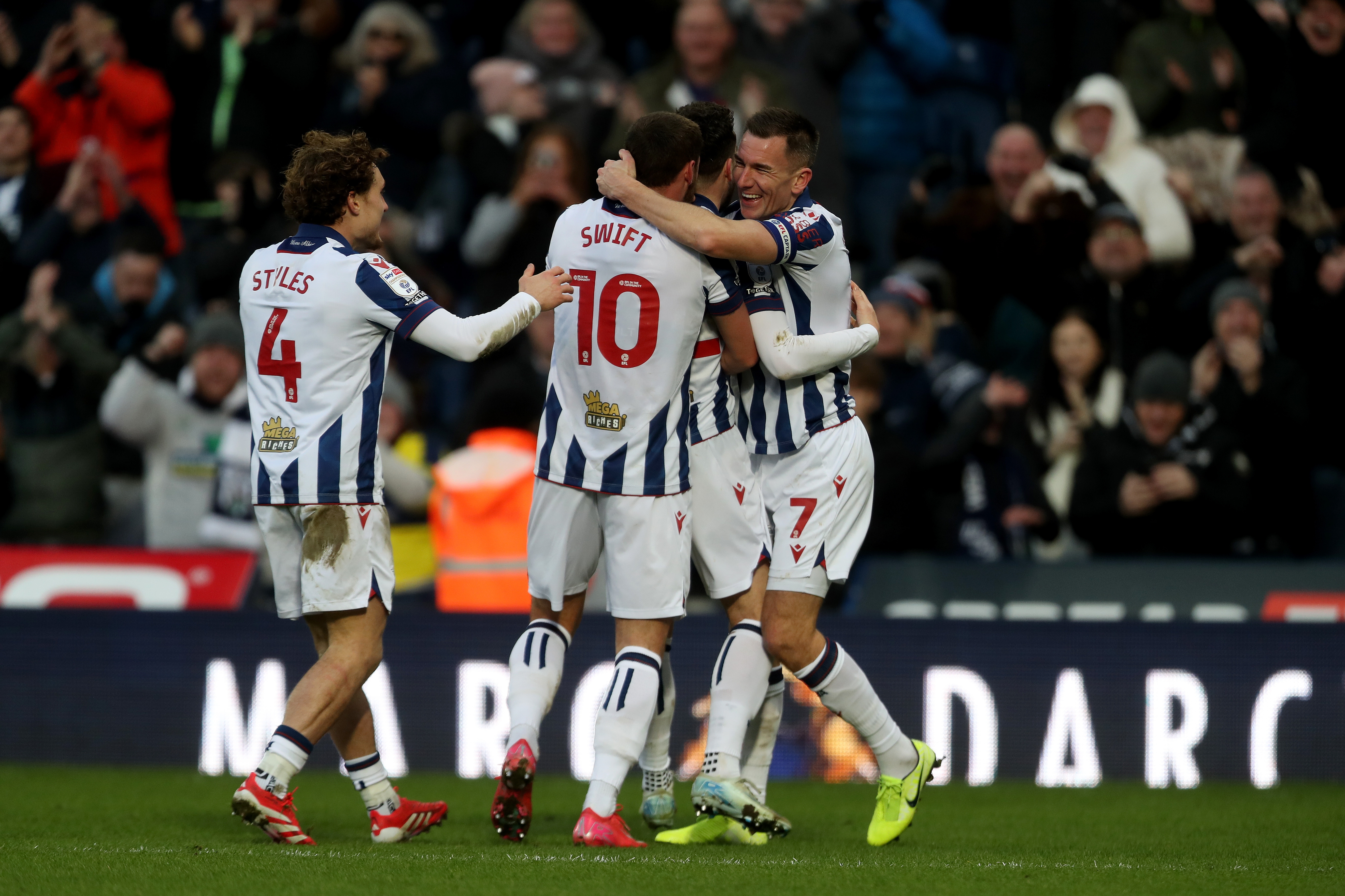 John Swift celebrates scoring against Portsmouth with team-mates